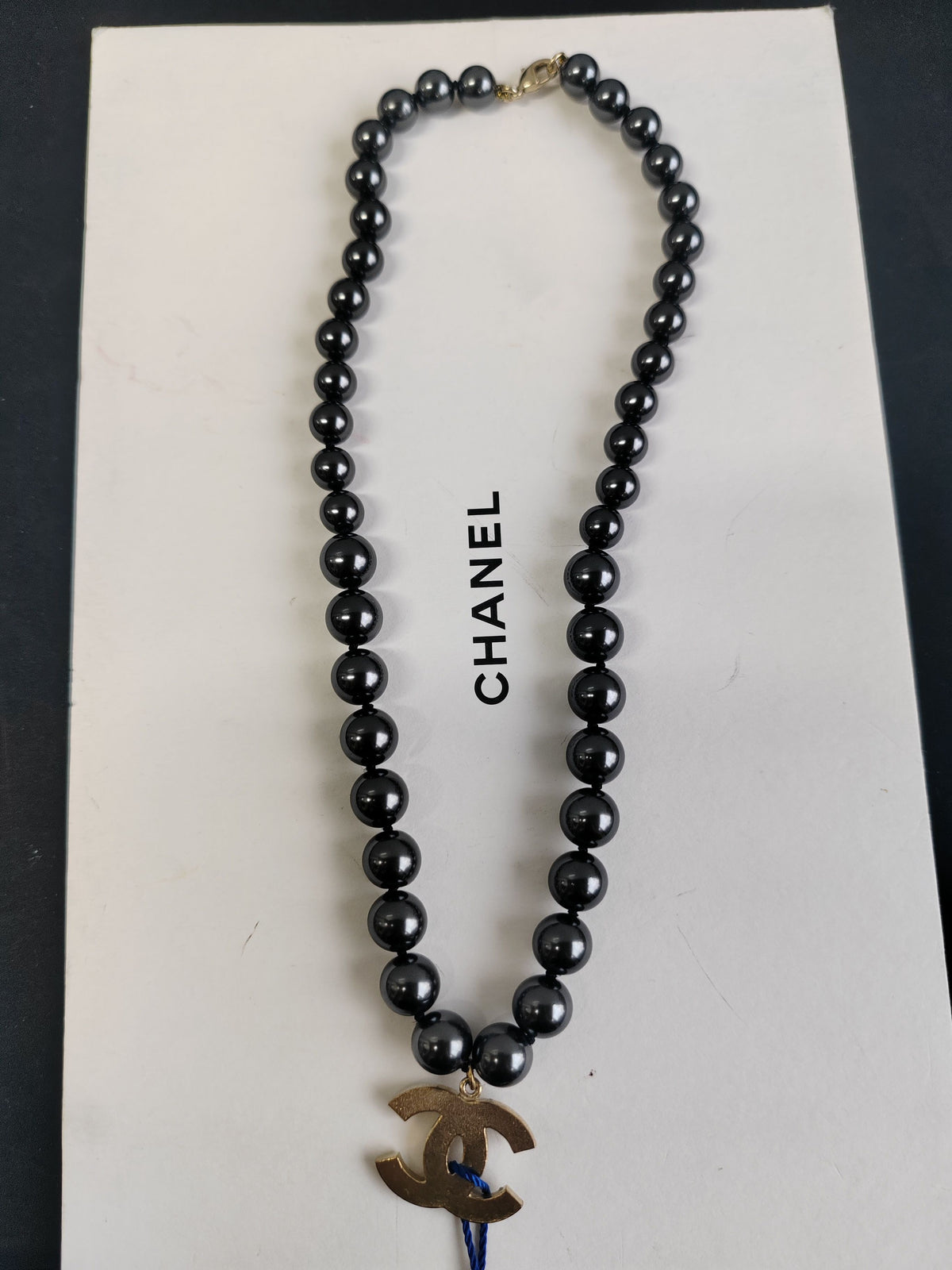 Chanel - Other - Gold-tone metal with black faux-pearl beads. - Black