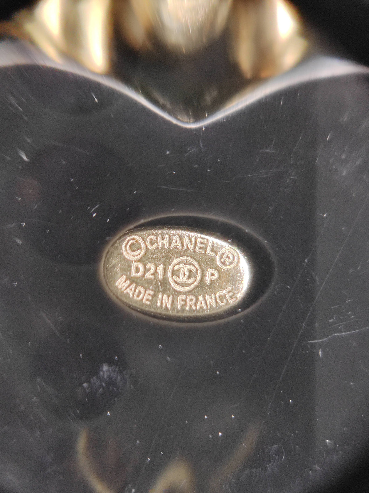 Chanel - Other - Gold-tone metal with black heart-shaped resin elements and crystal embellishment; composition not confirmed. - Black