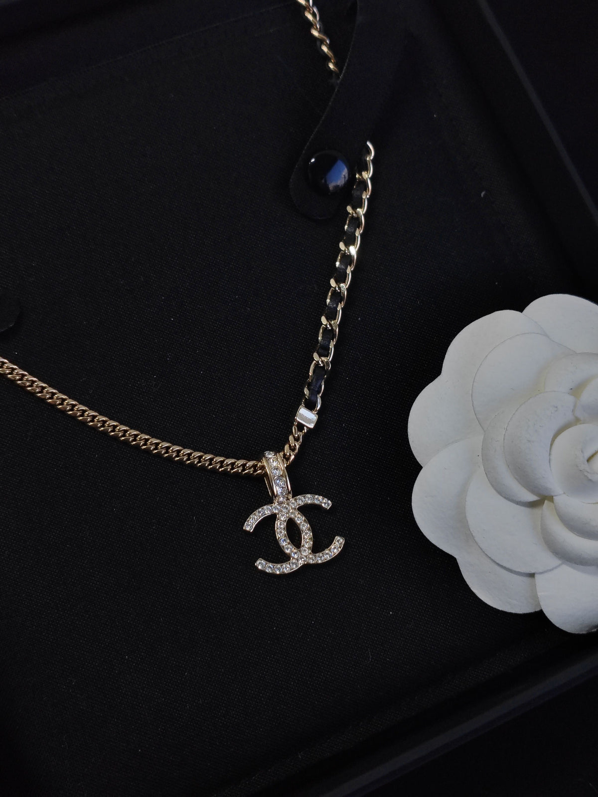 Chanel - Other - Gold-tone metal with black leather and clear rhinestone embellishment. - Multicolour
