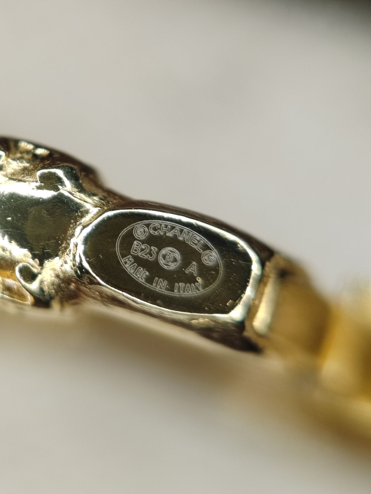 Chanel - Other - Gold-tone metal with black leather trim and crystal embellishment. - Gold