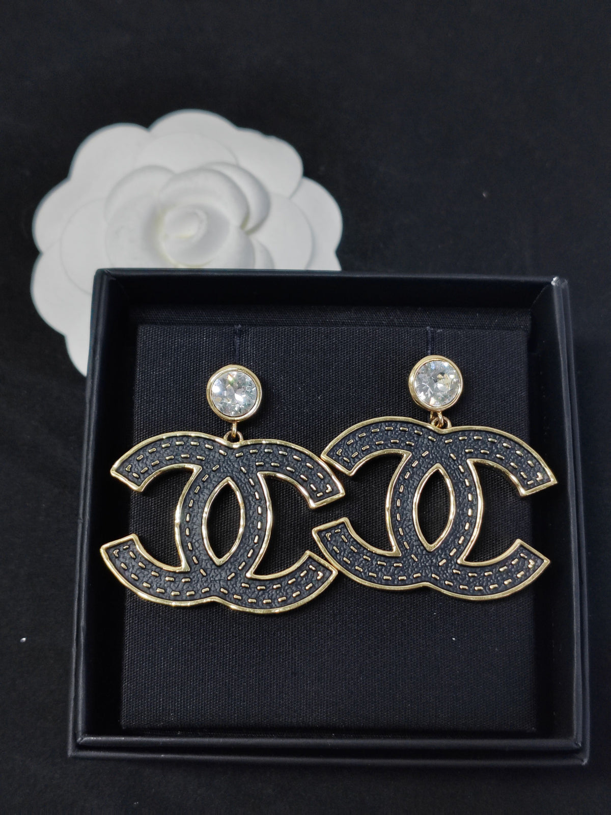 Chanel - Other - Gold-tone metal with black textured decorative panels and clear crystal-like accents; exact composition of the decorative elements is unconfirmed. - Black