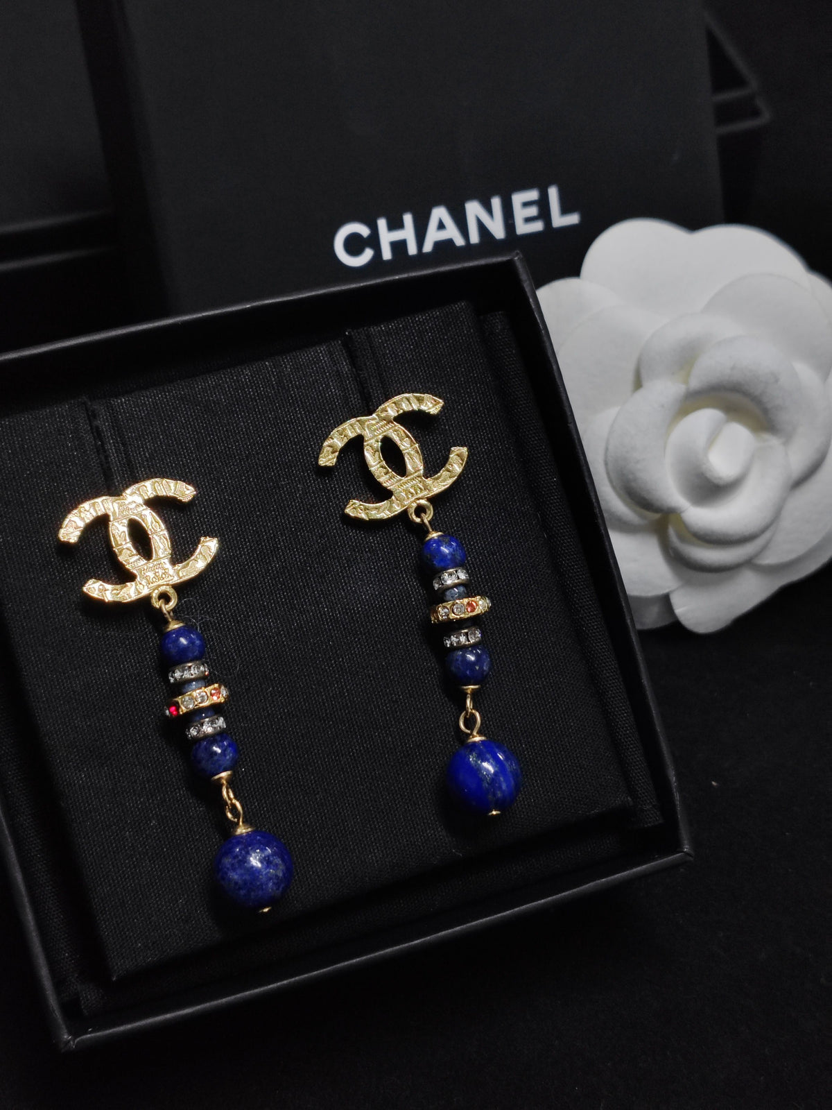 Chanel - Other - Gold-tone metal with blue bead drops and crystal-like accents; exact composition is unconfirmed. - Multicolour