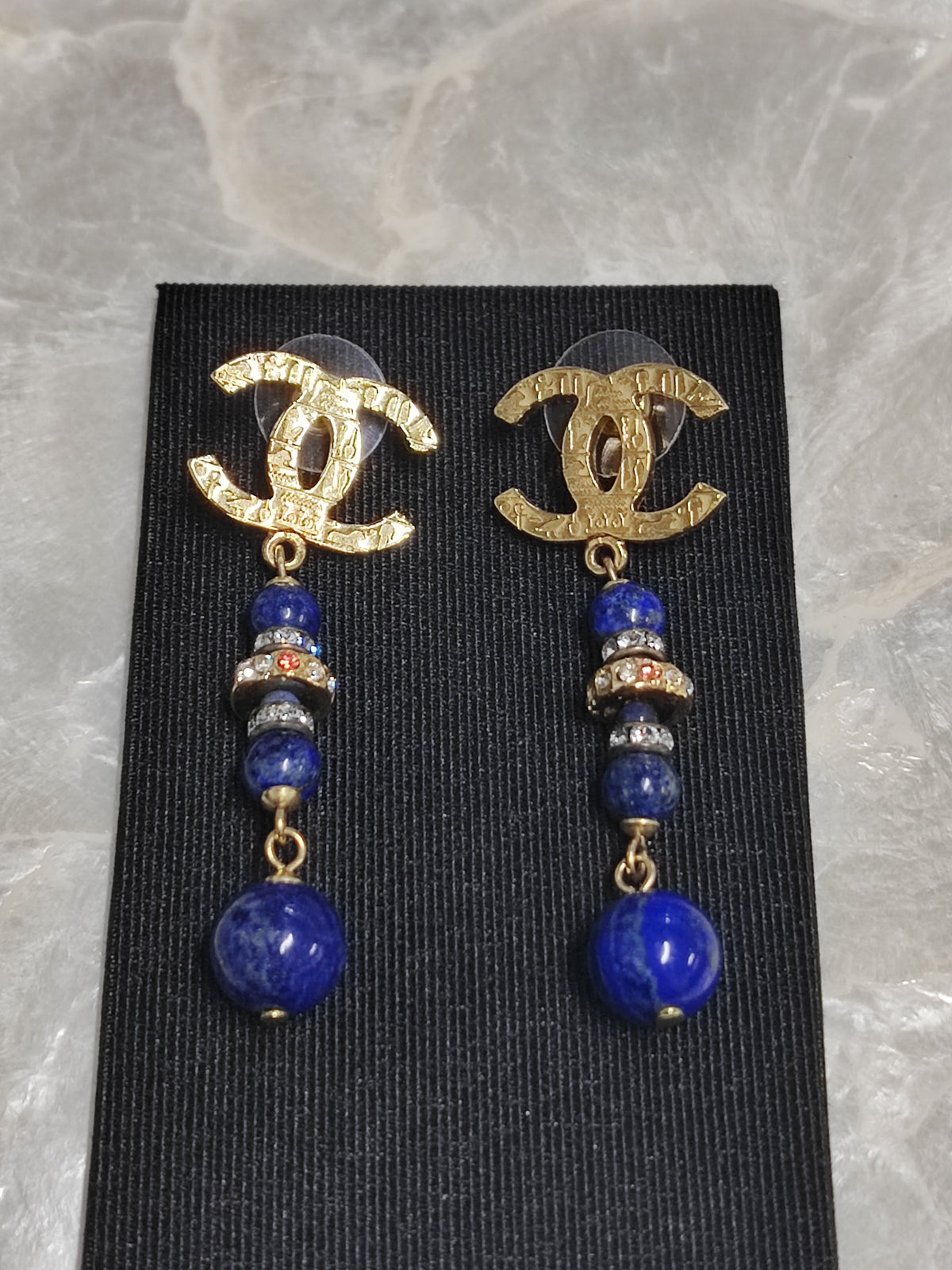 Chanel - Other - Gold-tone metal with blue bead drops and crystal-like accents; exact composition is unconfirmed. - Multicolour