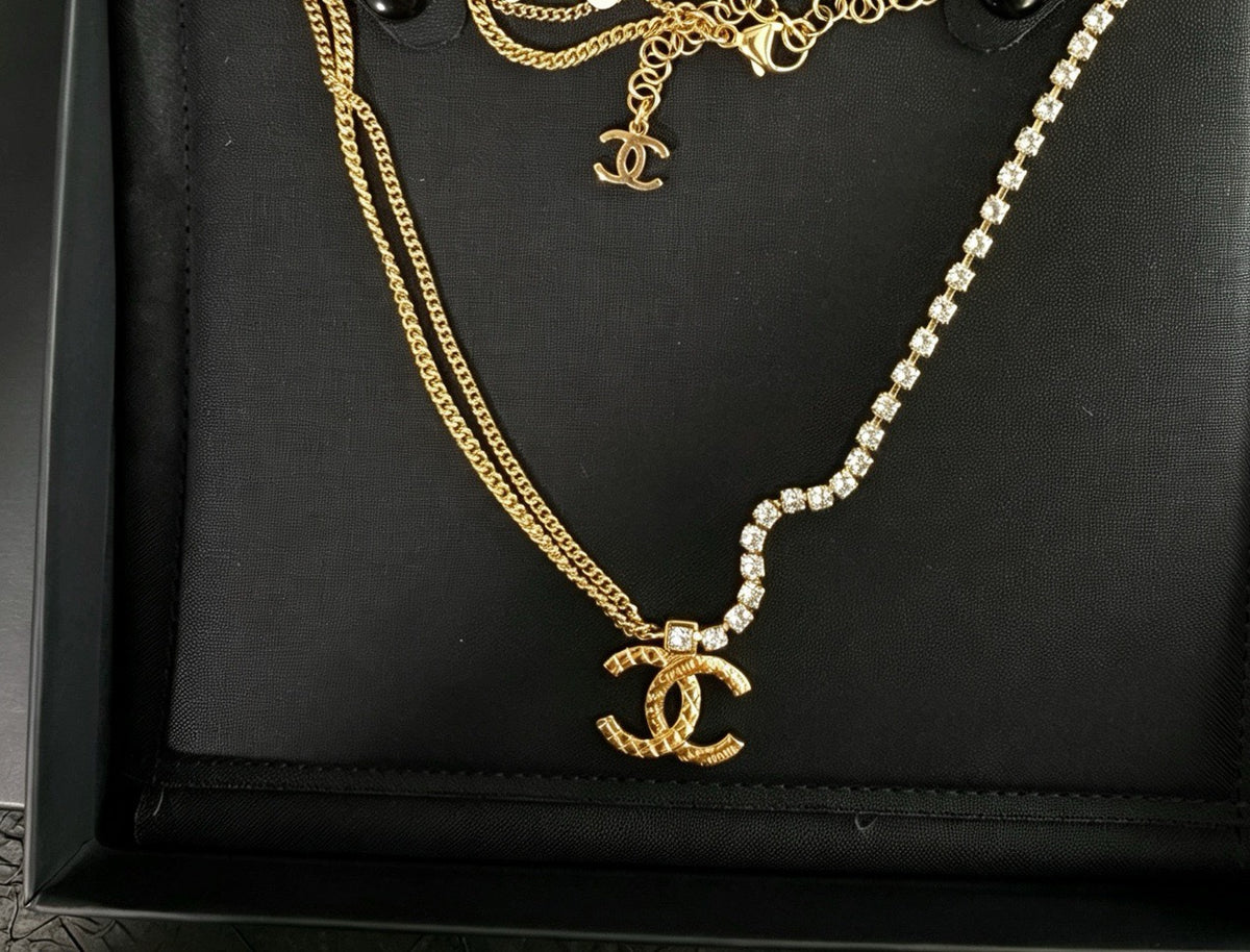 Chanel - Other - Gold-tone metal with clear crystal embellishments. - Gold