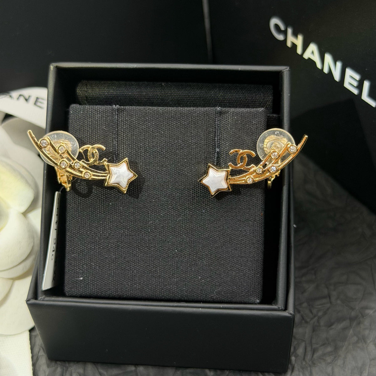 Chanel - Other - Gold-tone metal with clear crystal-like accents and white star-shaped inlays; exact composition unknown. - Gold