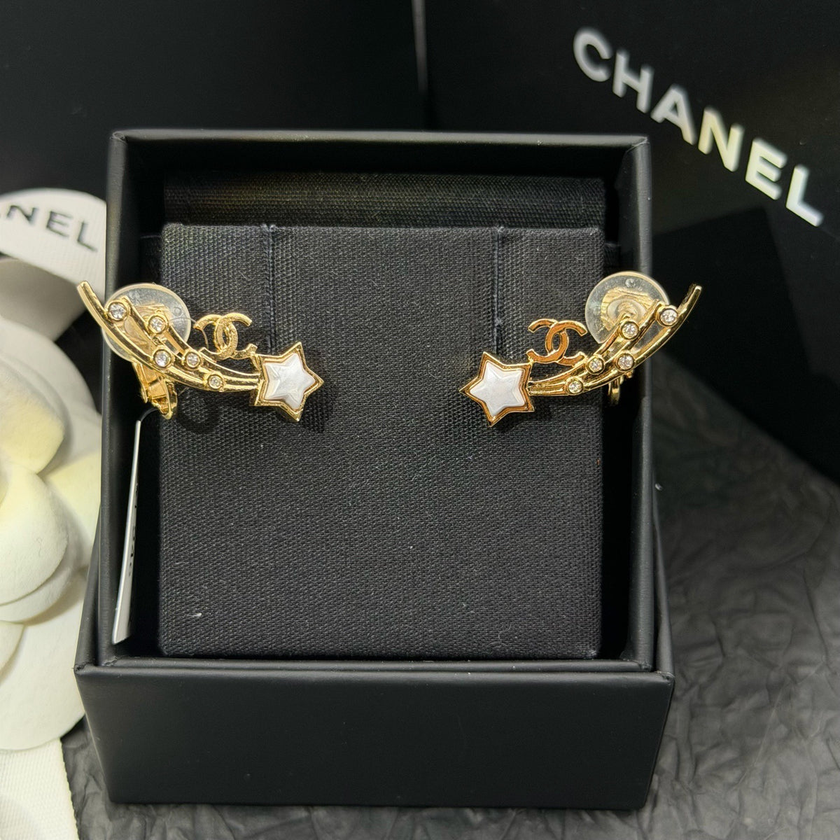 Chanel - Other - Gold-tone metal with clear crystal-like accents and white star-shaped inlays; exact composition unknown. - Gold