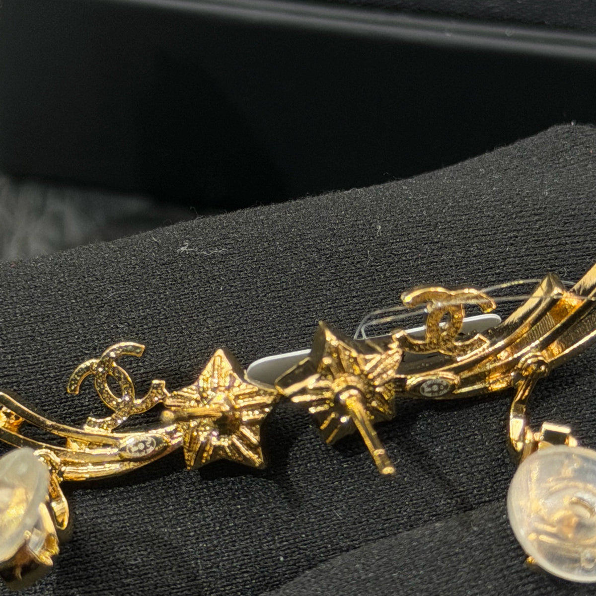 Chanel - Other - Gold-tone metal with clear crystal-like accents and white star-shaped inlays; exact composition unknown. - Gold