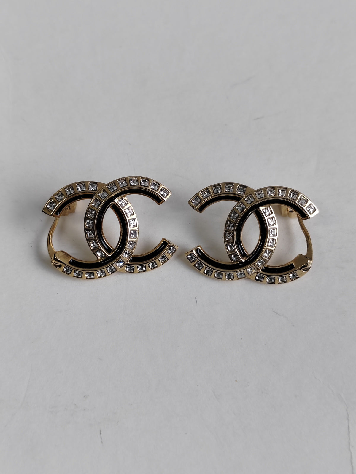 Chanel - Other - Gold-tone metal with clear crystal-like stones and black detailing. - Multicolour