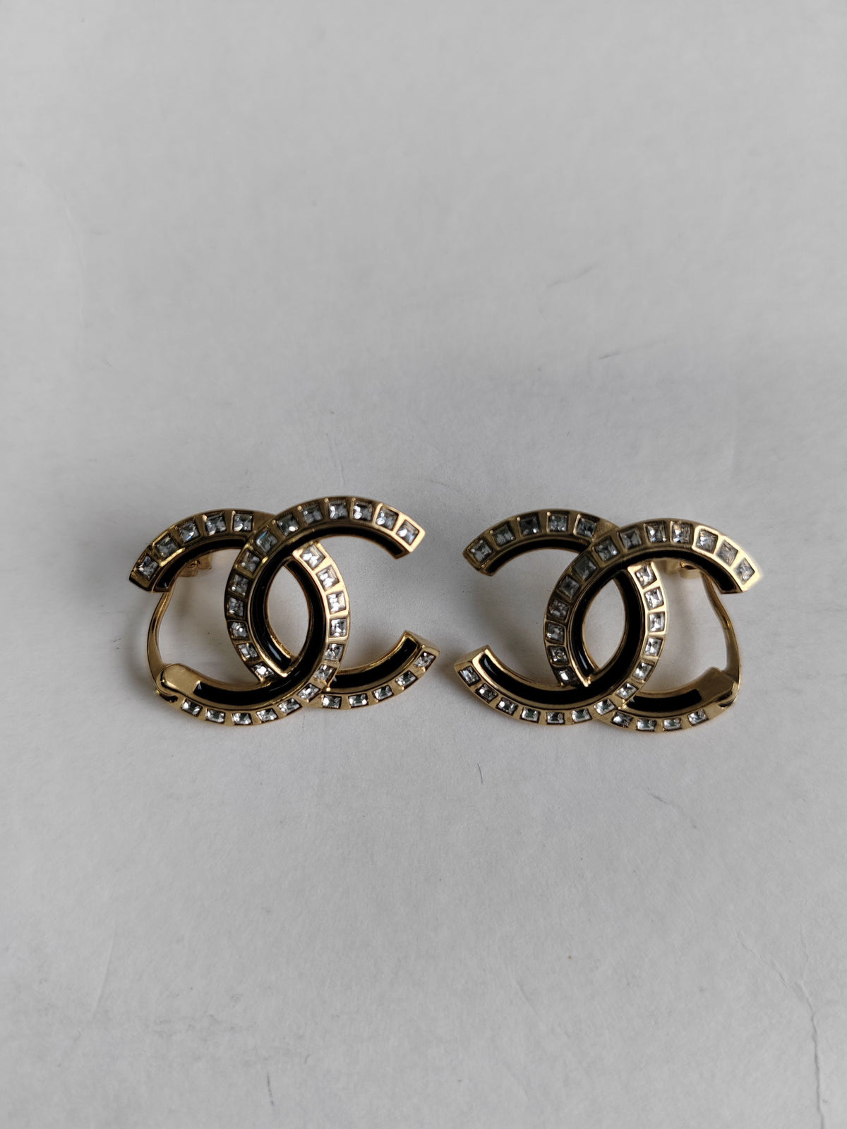 Chanel - Other - Gold-tone metal with clear crystal-like stones and black detailing. - Multicolour