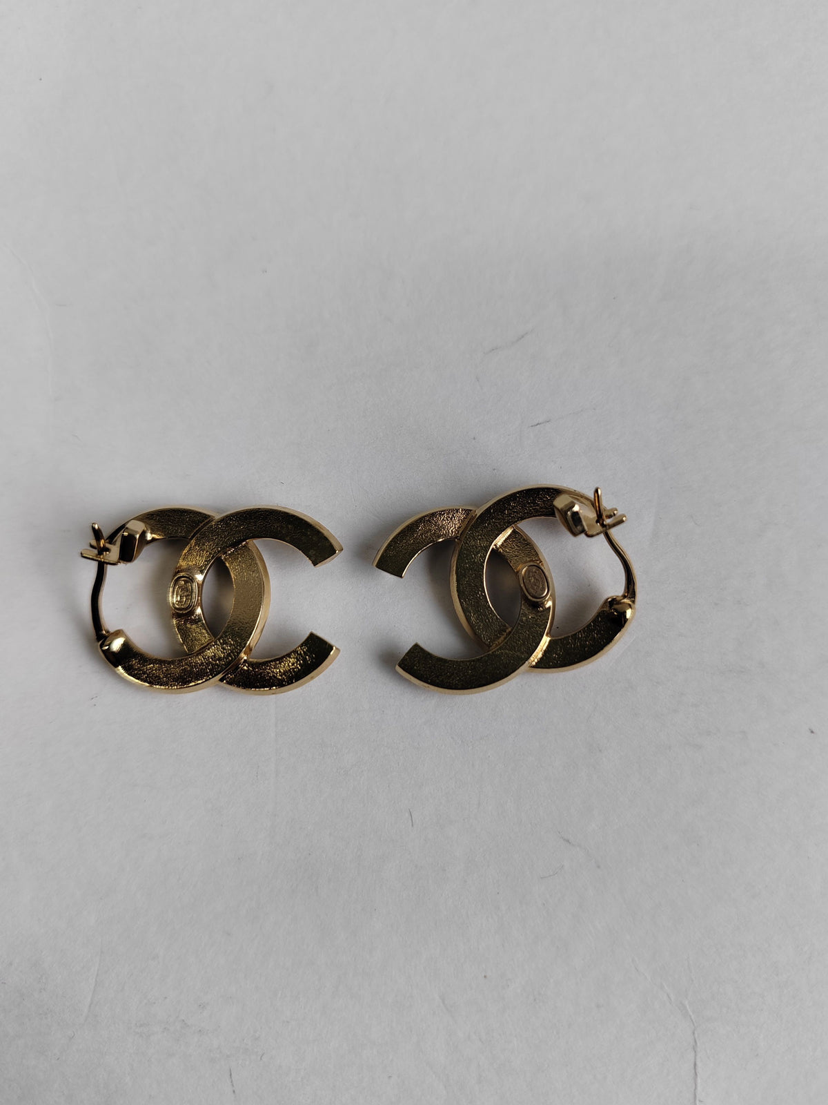 Chanel - Other - Gold-tone metal with clear crystal-like stones and black detailing. - Multicolour
