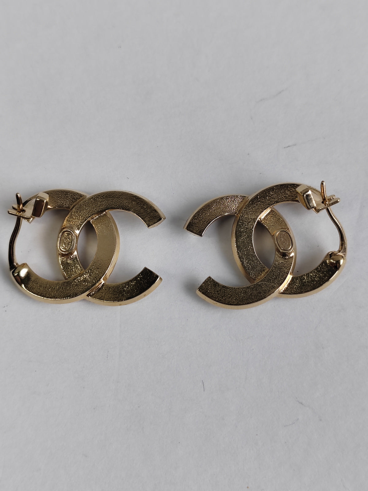 Chanel - Other - Gold-tone metal with clear crystal-like stones and black detailing. - Multicolour