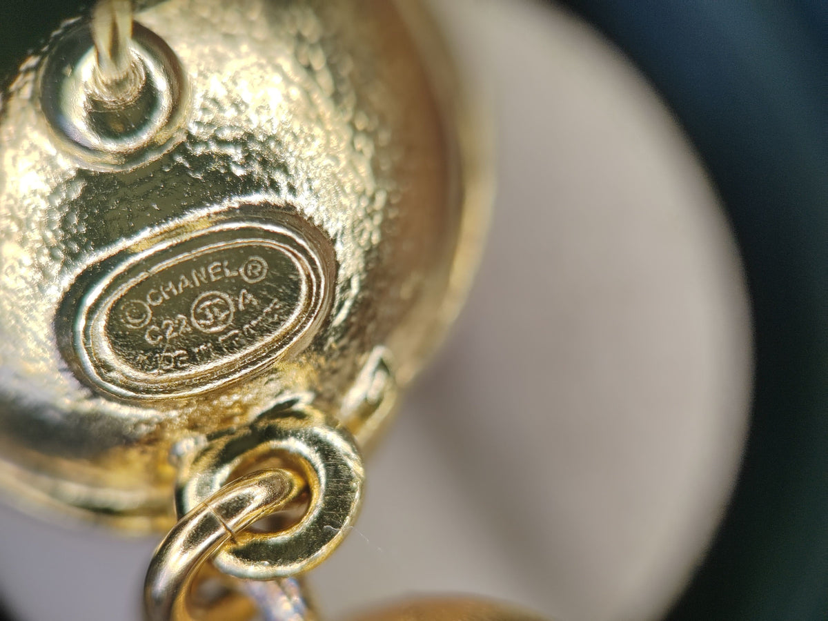 Chanel - Other - Gold-tone metal with clear crystals and pink cabochons; exact composition unknown. - Pink