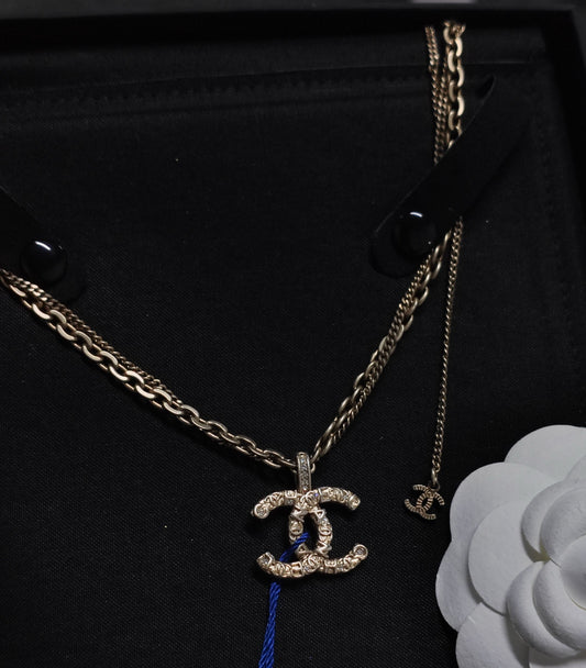 Chanel - Other - Gold-tone metal with clear decorative stones. - Gold