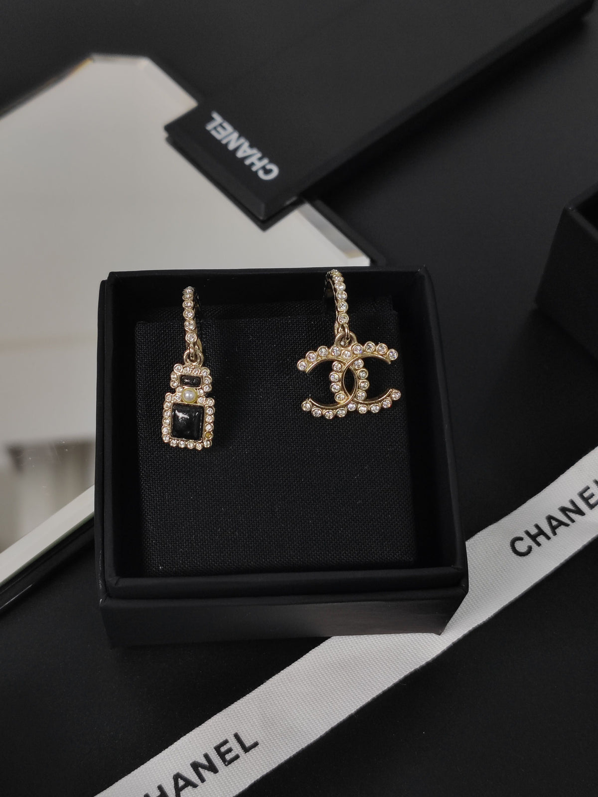 Chanel - Other - Gold-tone metal with clear glass rhinestones, black accents and a faux pearl accent. - Gold