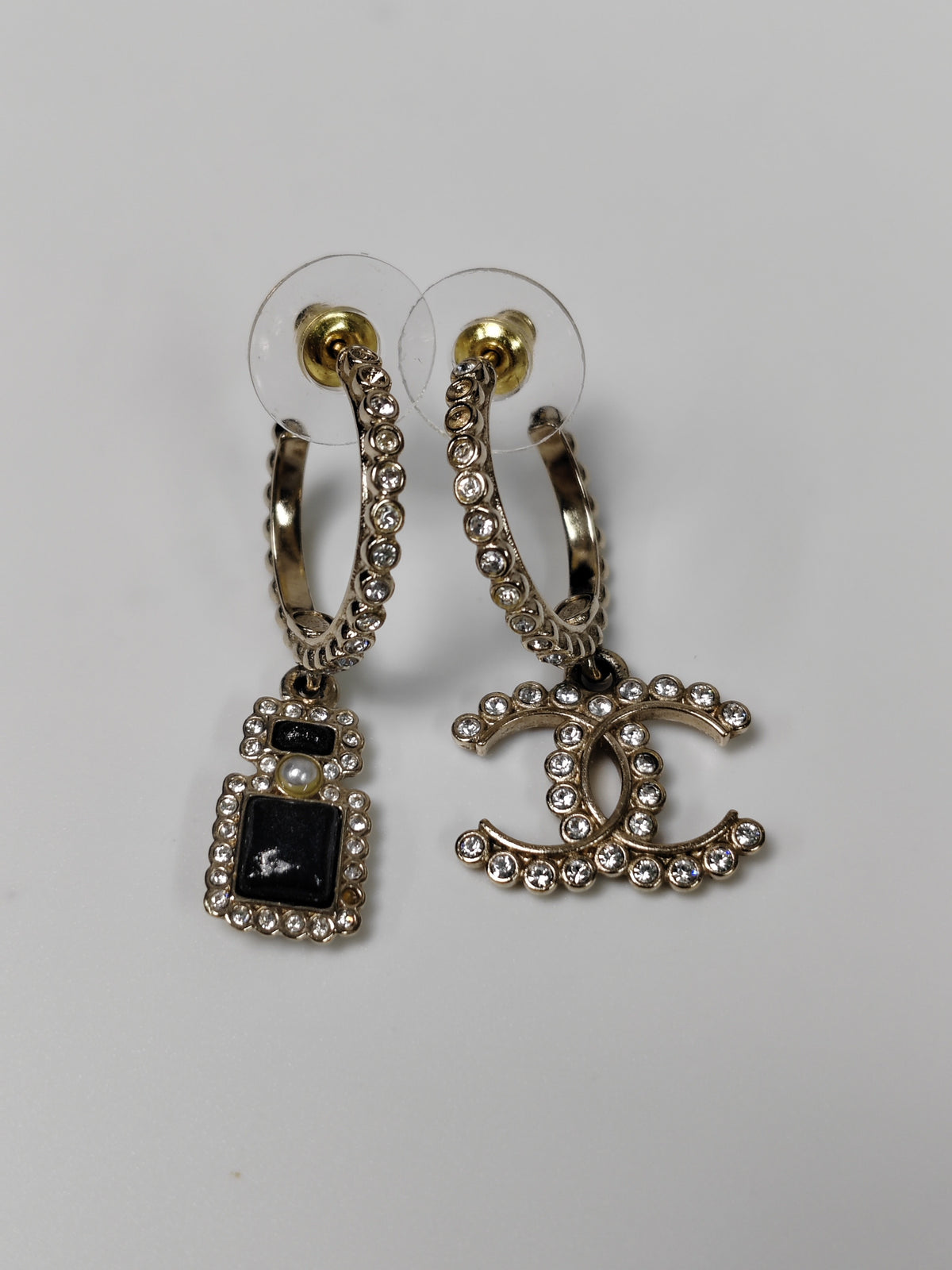 Chanel - Other - Gold-tone metal with clear glass rhinestones, black accents and a faux pearl accent. - Gold