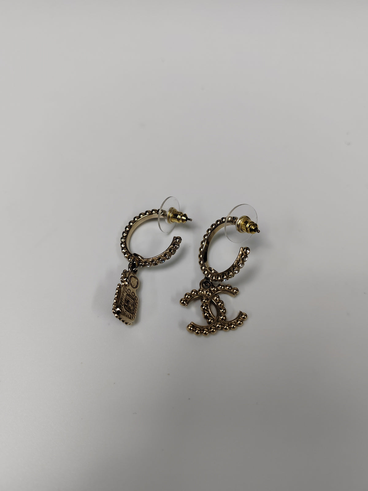 Chanel - Other - Gold-tone metal with clear glass rhinestones, black accents and a faux pearl accent. - Gold