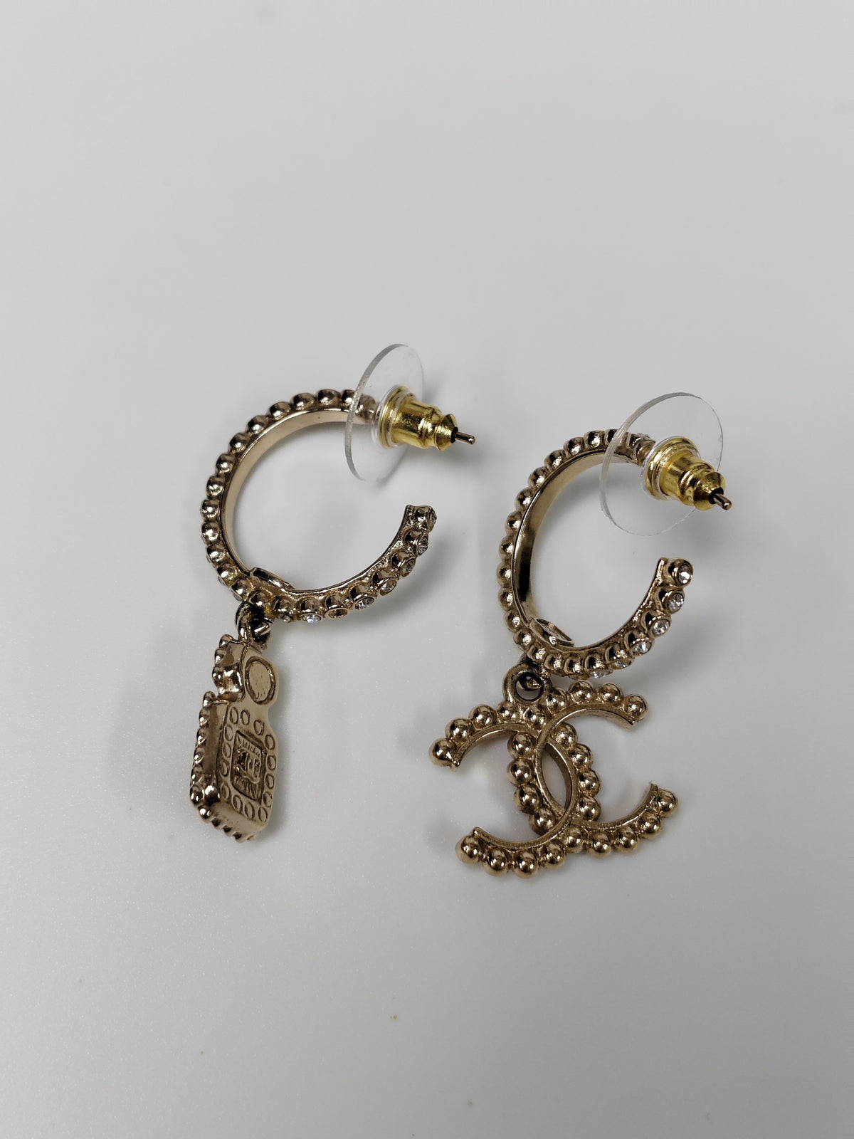 Chanel - Other - Gold-tone metal with clear glass rhinestones, black accents and a faux pearl accent. - Gold