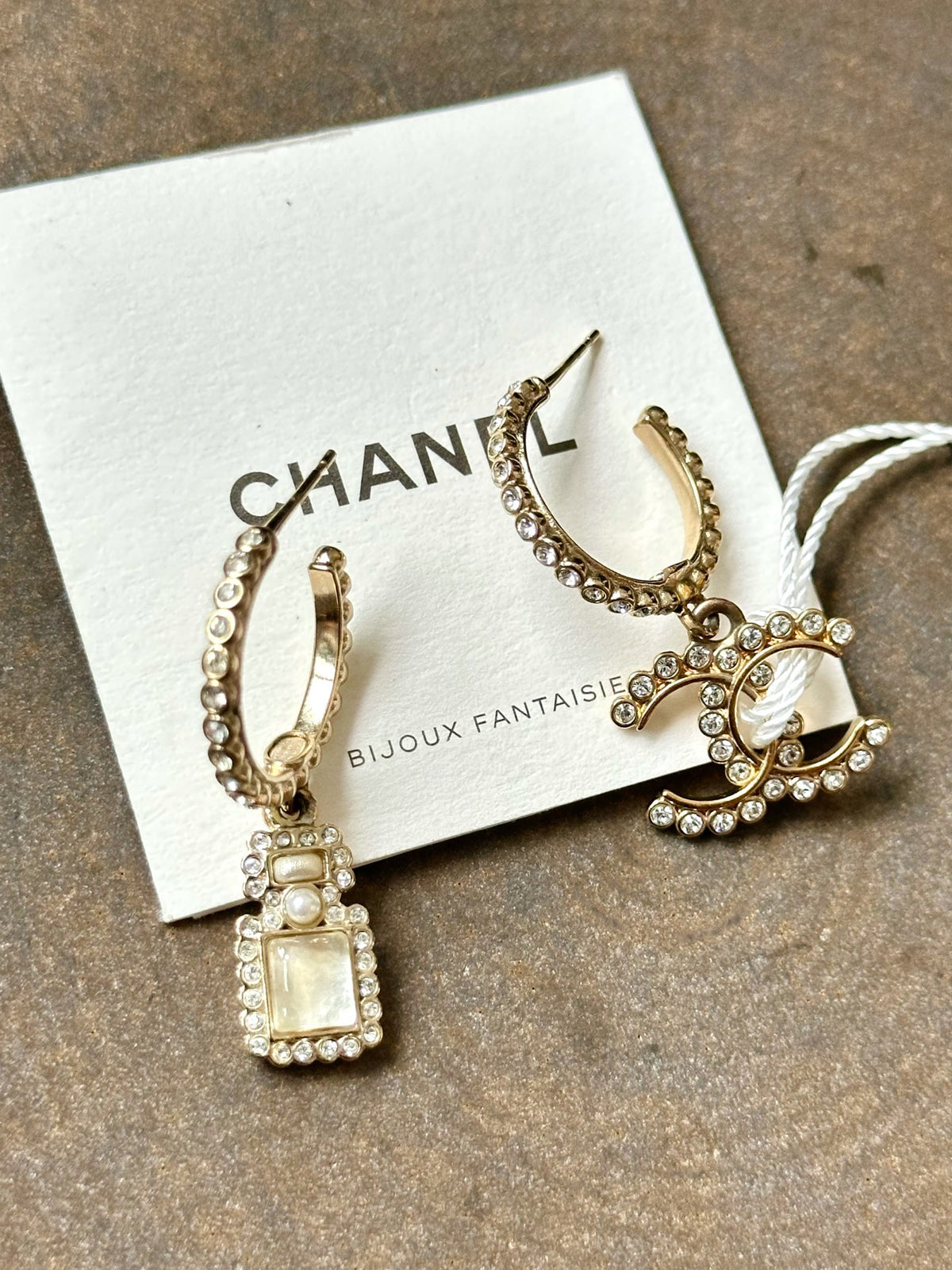 Chanel - Other - Gold-tone metal with clear rhinestone accents, a faux pearl and pale iridescent details. - Gold