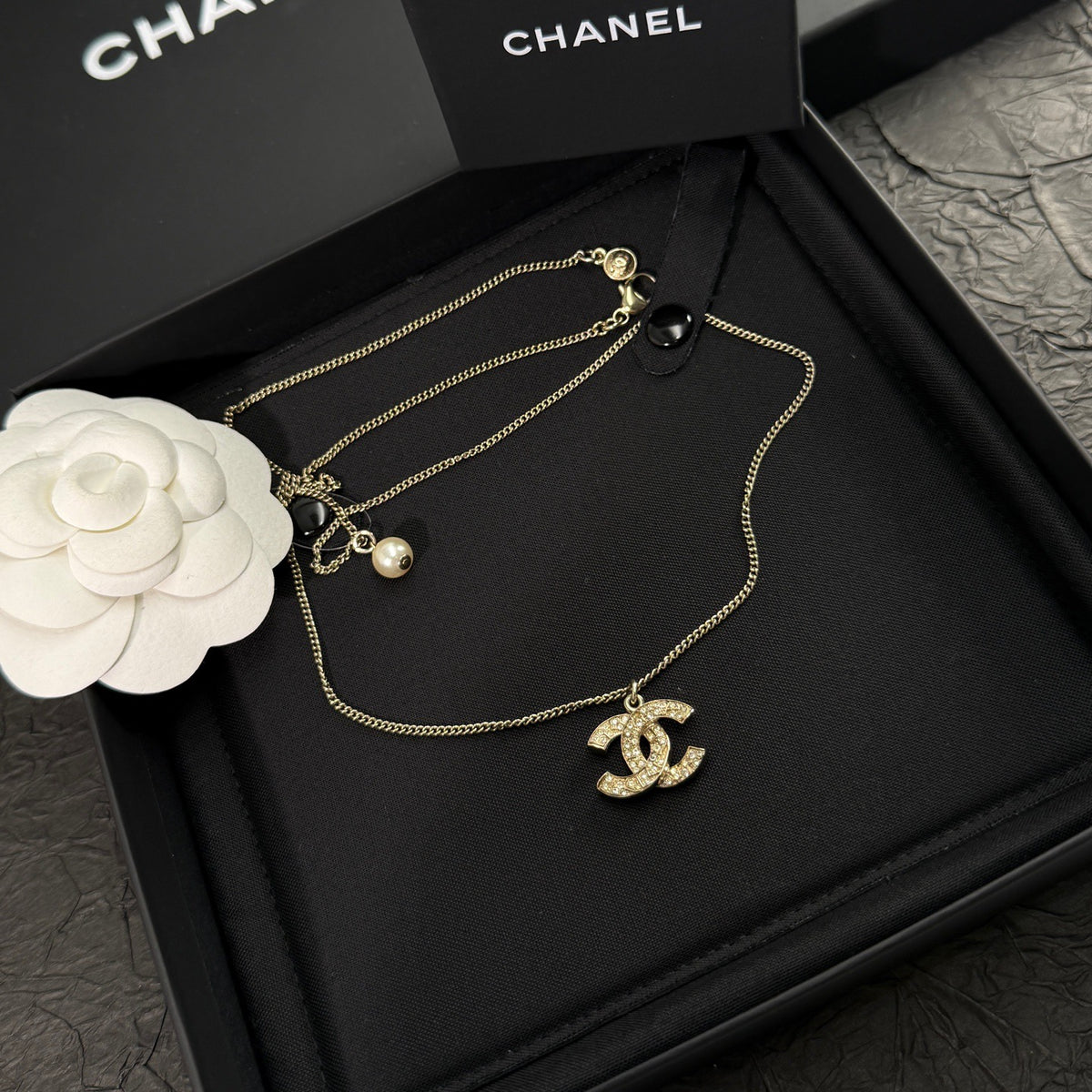 Chanel - Other - Gold-tone metal with clear rhinestone accents and a pearl-like drop - Gold - (43+15)