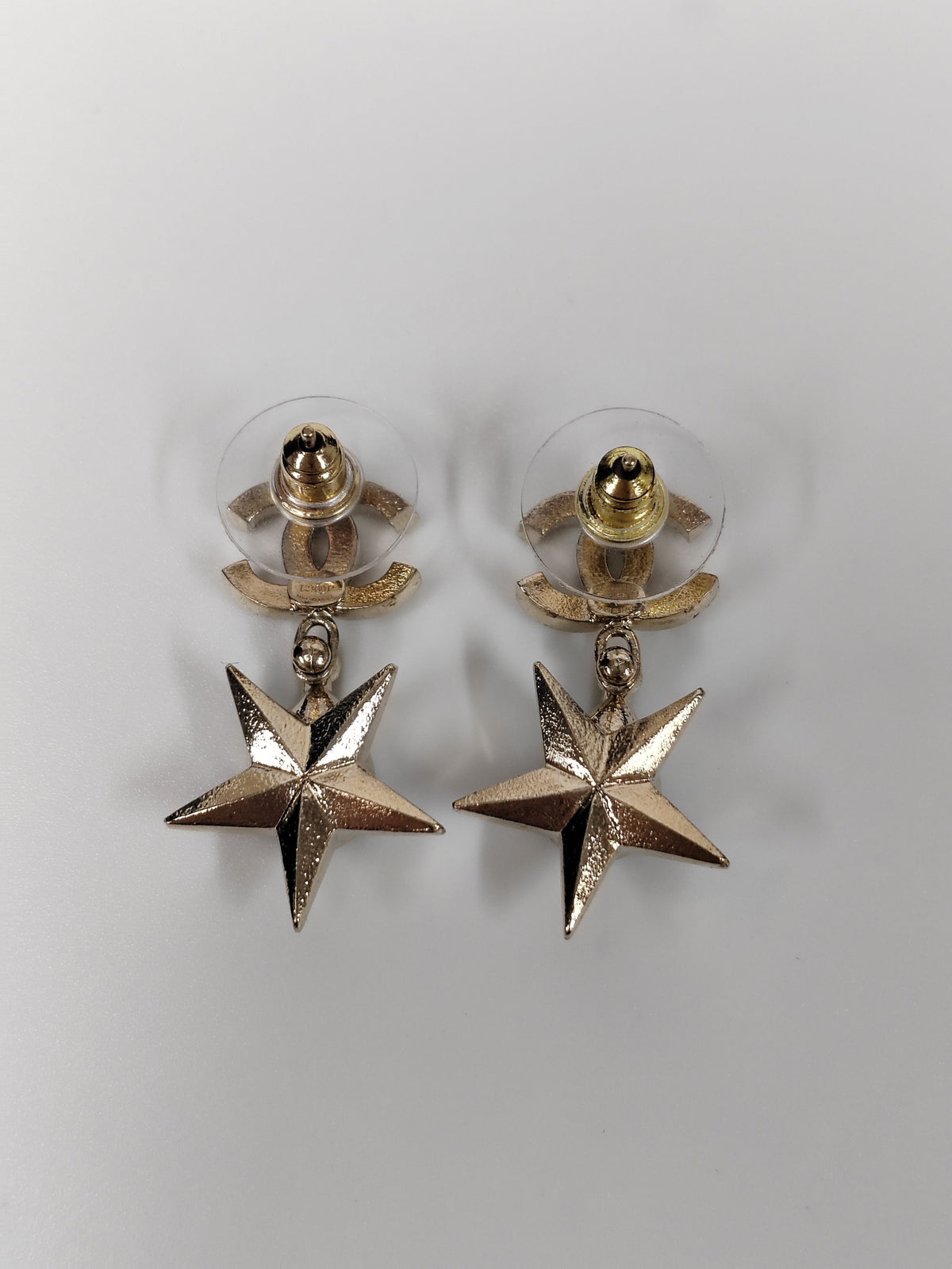 Chanel - Other - Gold-tone metal with clear rhinestone embellishment and grey cabochon-style accents; exact stone composition is not established. - Gold