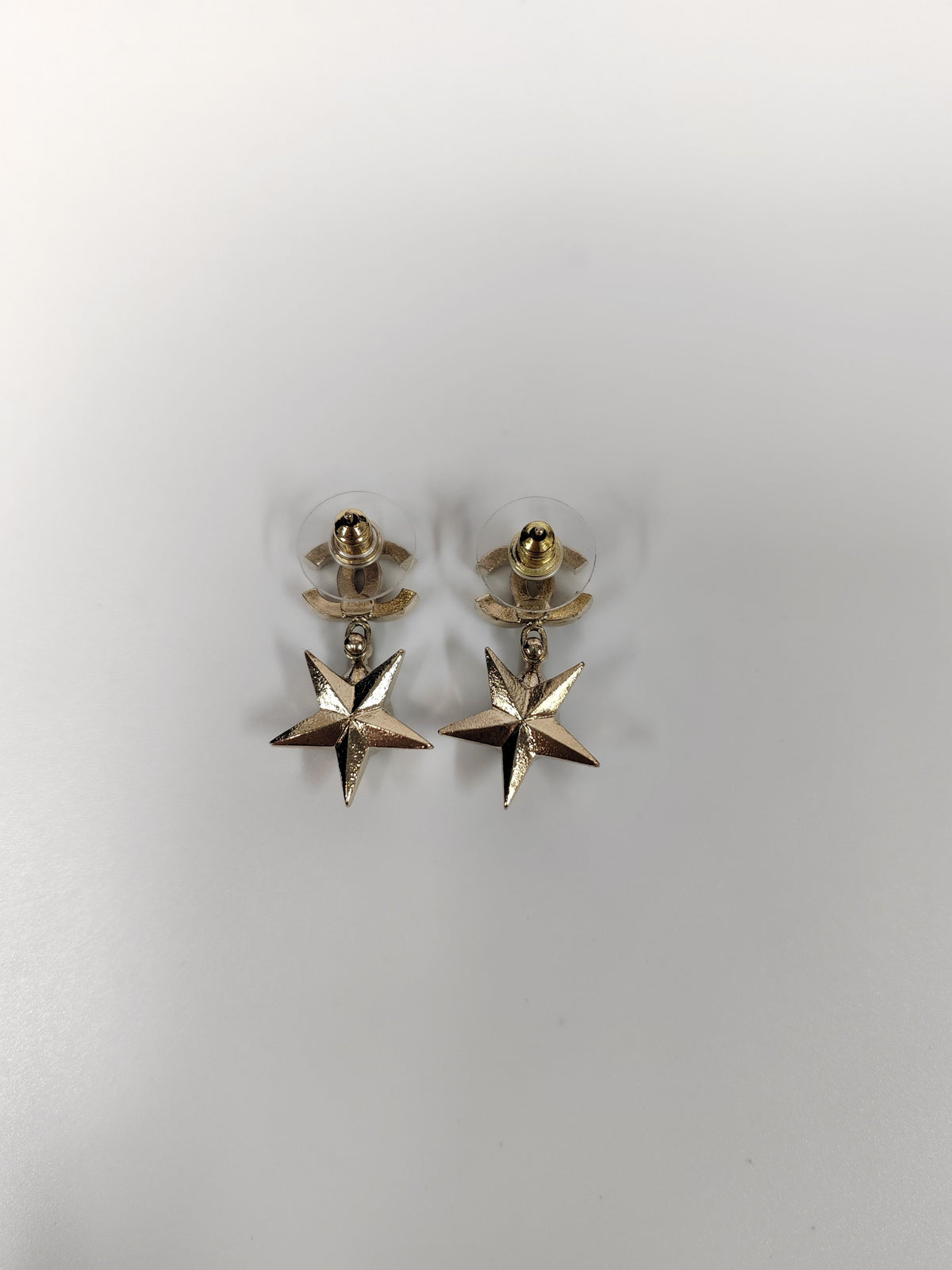 Chanel - Other - Gold-tone metal with clear rhinestone embellishment and grey cabochon-style accents; exact stone composition is not established. - Gold