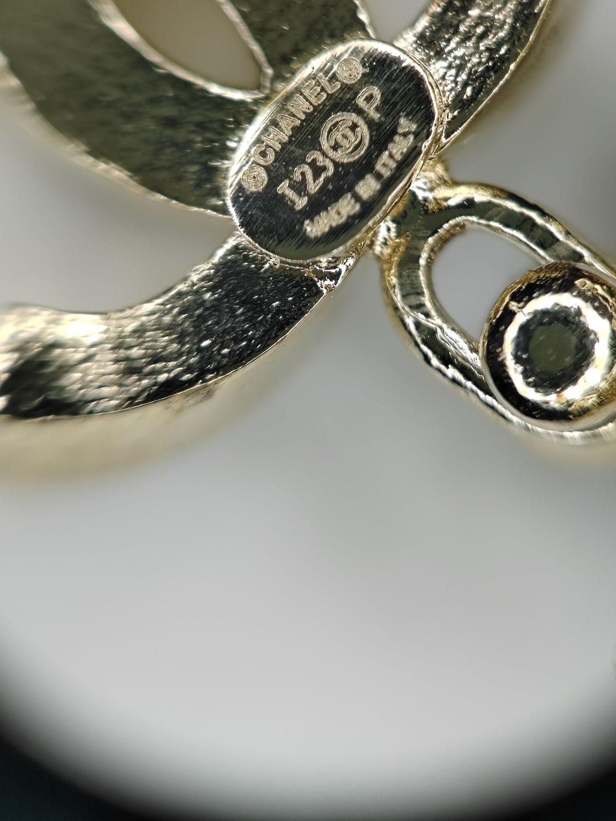 Chanel - Other - Gold-tone metal with clear rhinestone embellishment and grey cabochon-style accents; exact stone composition is not established. - Gold