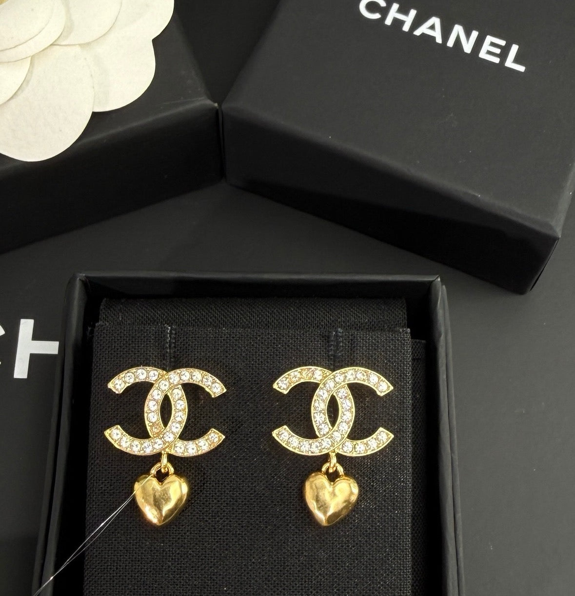 Chanel - Other - Gold-tone metal with clear rhinestone embellishments and dangling heart charms. - Gold