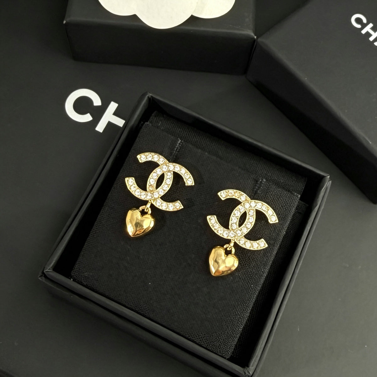 Chanel - Other - Gold-tone metal with clear rhinestone embellishments and dangling heart charms. - Gold