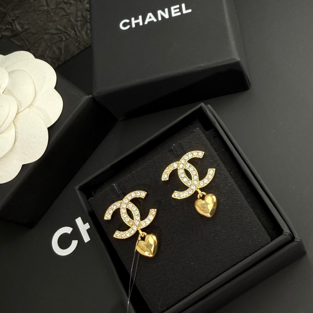 Chanel - Other - Gold-tone metal with clear rhinestone embellishments and dangling heart charms. - Gold
