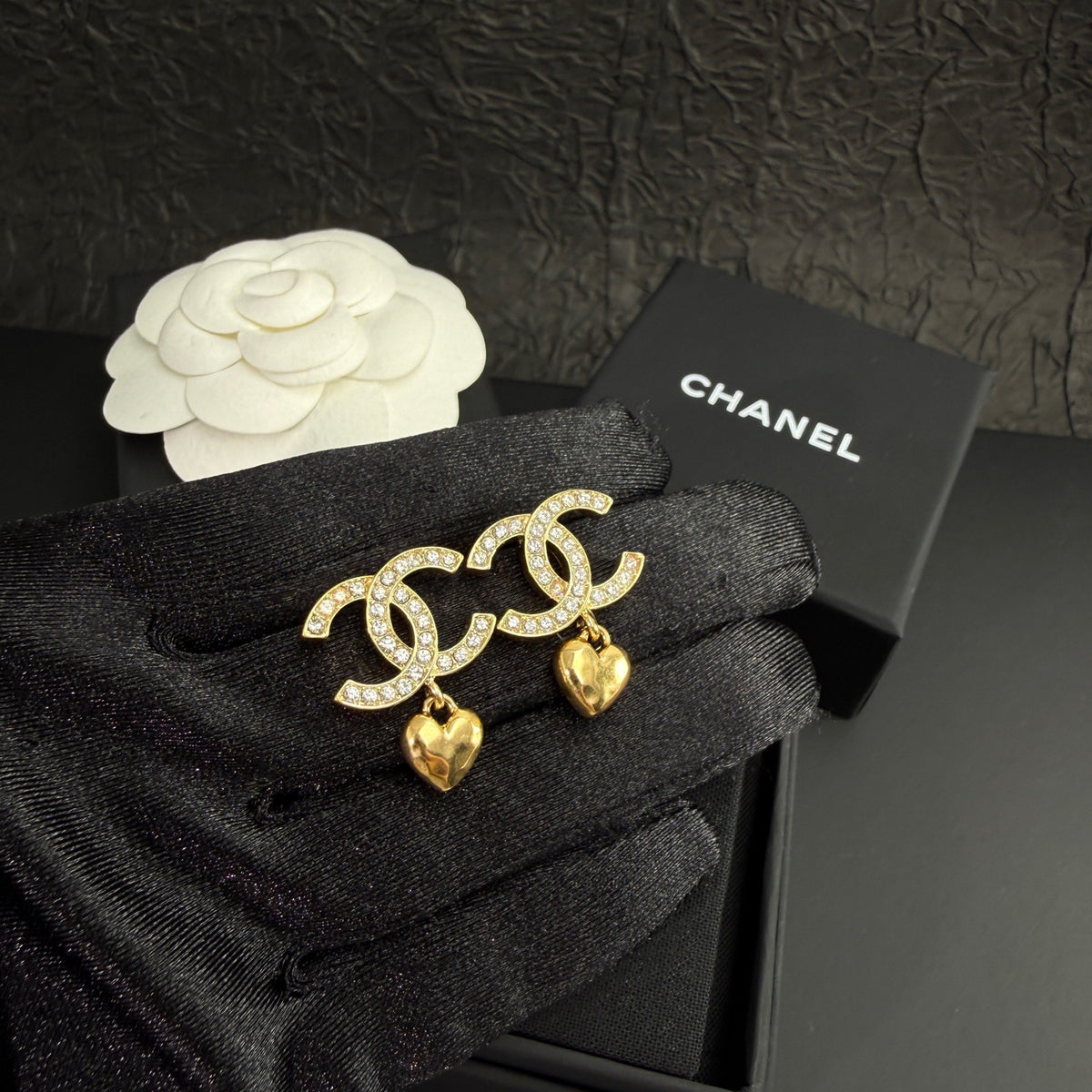 Chanel - Other - Gold-tone metal with clear rhinestone embellishments and dangling heart charms. - Gold