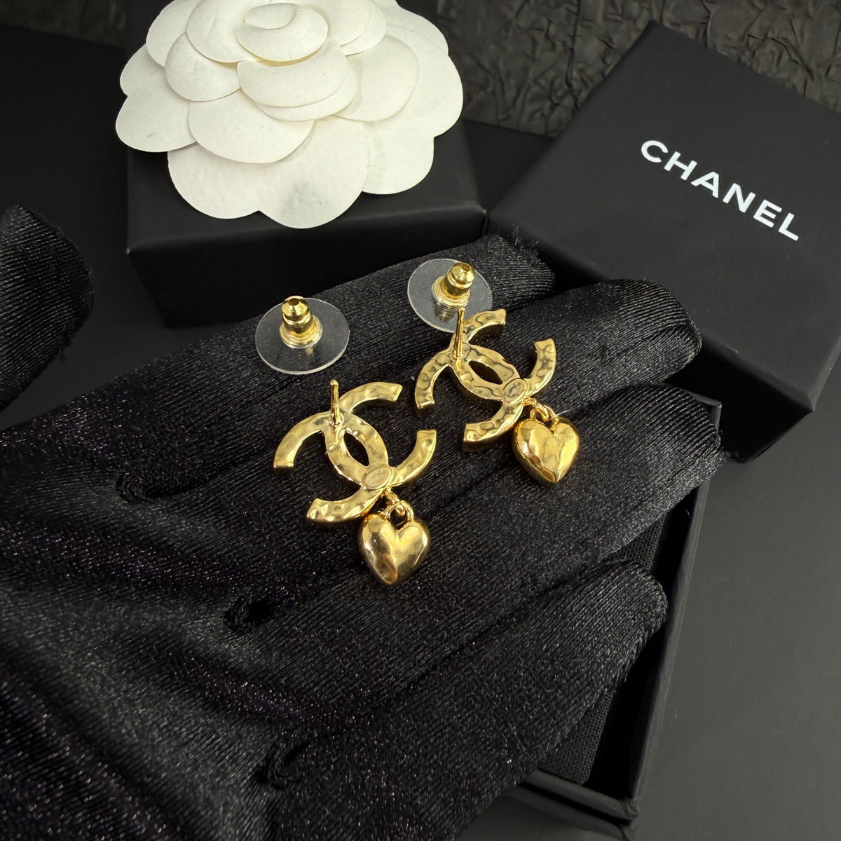 Chanel - Other - Gold-tone metal with clear rhinestone embellishments and dangling heart charms. - Gold