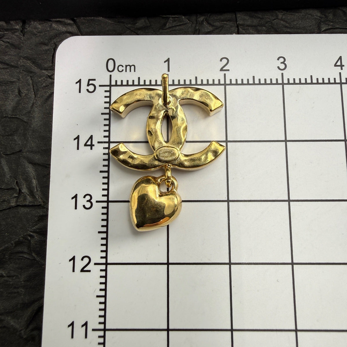 Chanel - Other - Gold-tone metal with clear rhinestone embellishments and dangling heart charms. - Gold