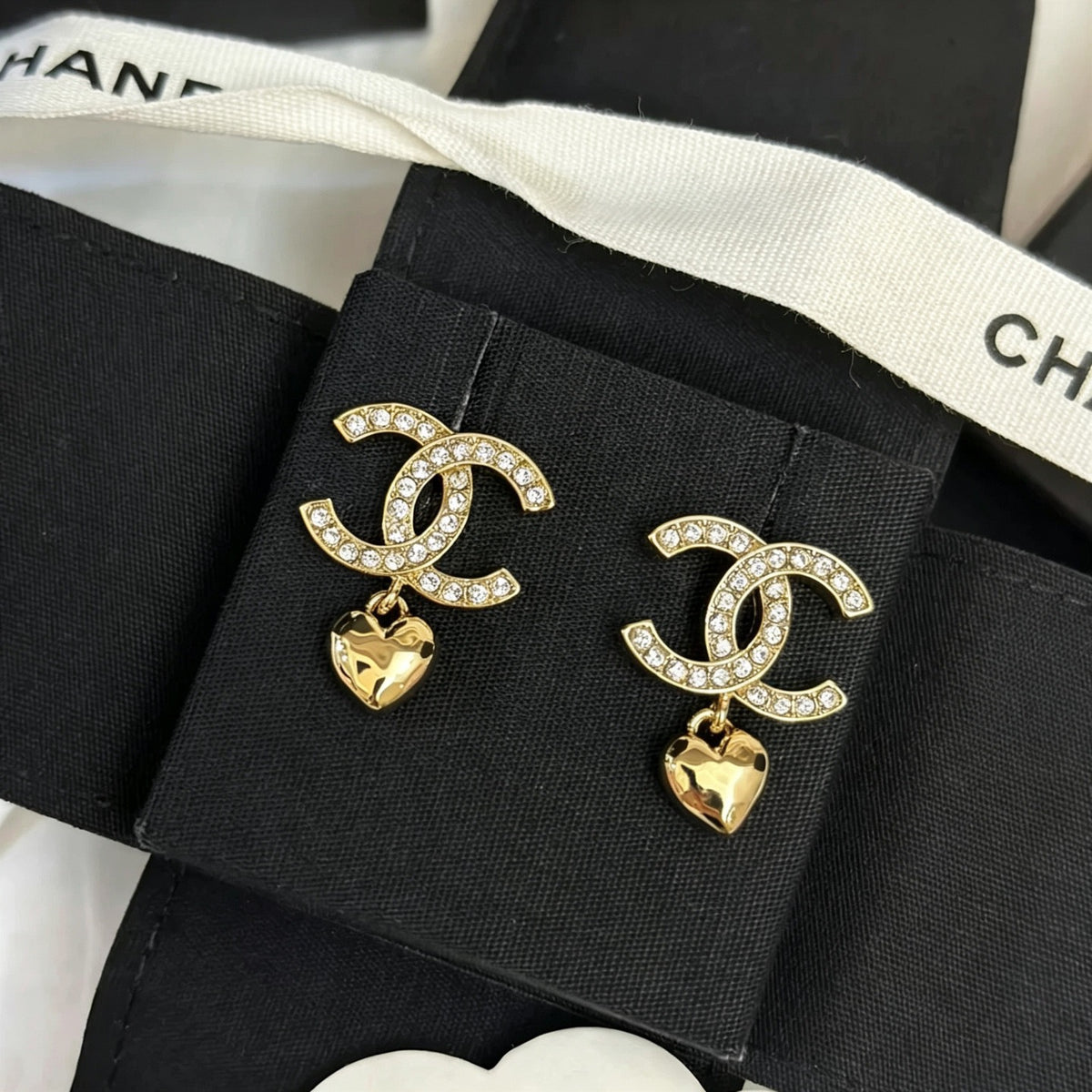Chanel - Other - Gold-tone metal with clear rhinestone embellishments and dangling heart charms. - Gold