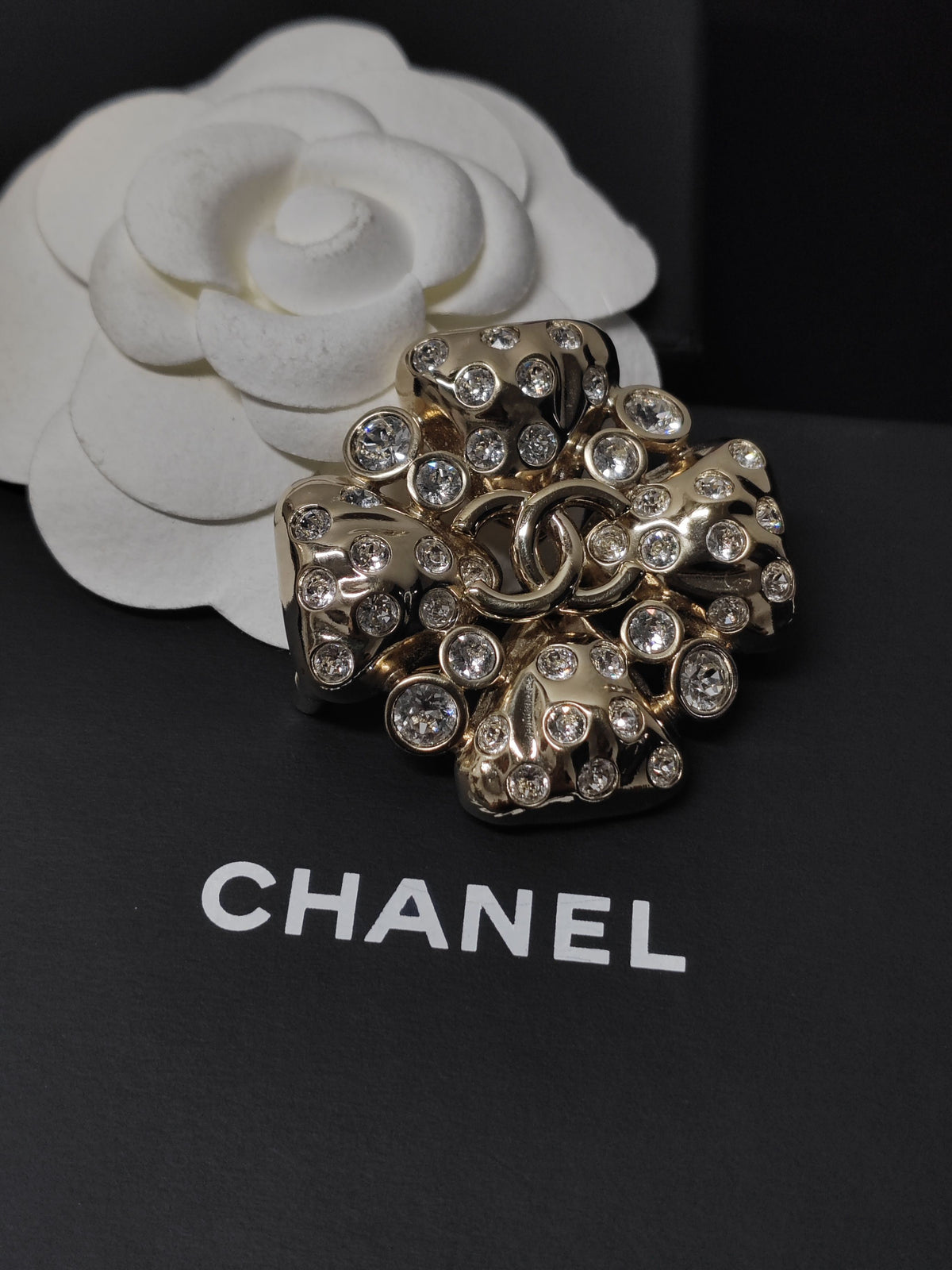 Chanel - Other - Gold-tone metal with clear rhinestone embellishments; exact base-metal composition is not confirmed. - Gold