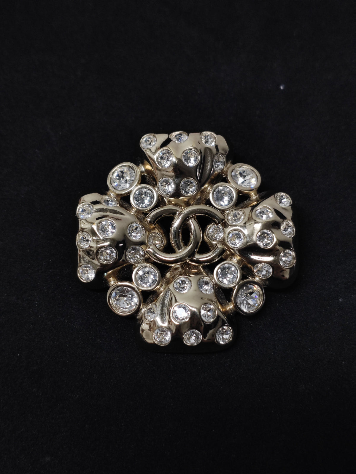 Chanel - Other - Gold-tone metal with clear rhinestone embellishments; exact base-metal composition is not confirmed. - Gold