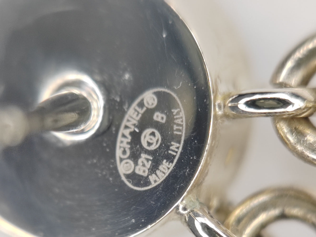 Chanel - Other - Gold-tone metal with clear rhinestones and white enamel accents. - Gold