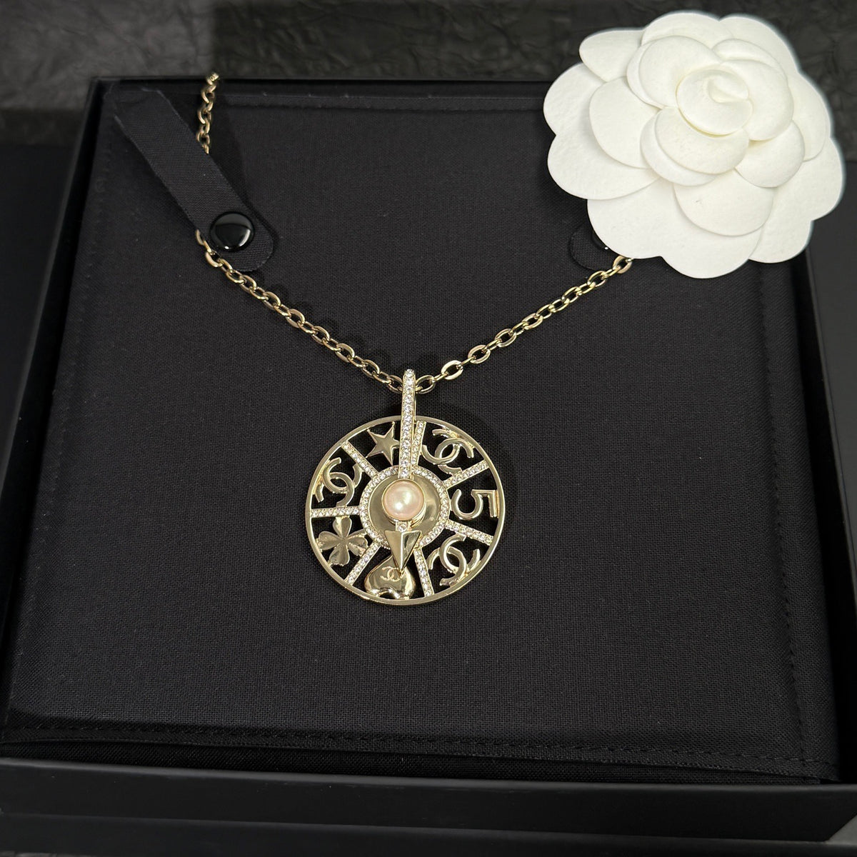 Chanel - Other - Gold-tone metal with crystal-style rhinestones and a faux pearl. - Gold