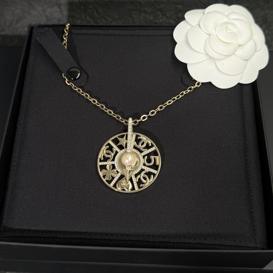 Chanel - Other - Gold-tone metal with crystal-style rhinestones and a faux pearl. - Gold