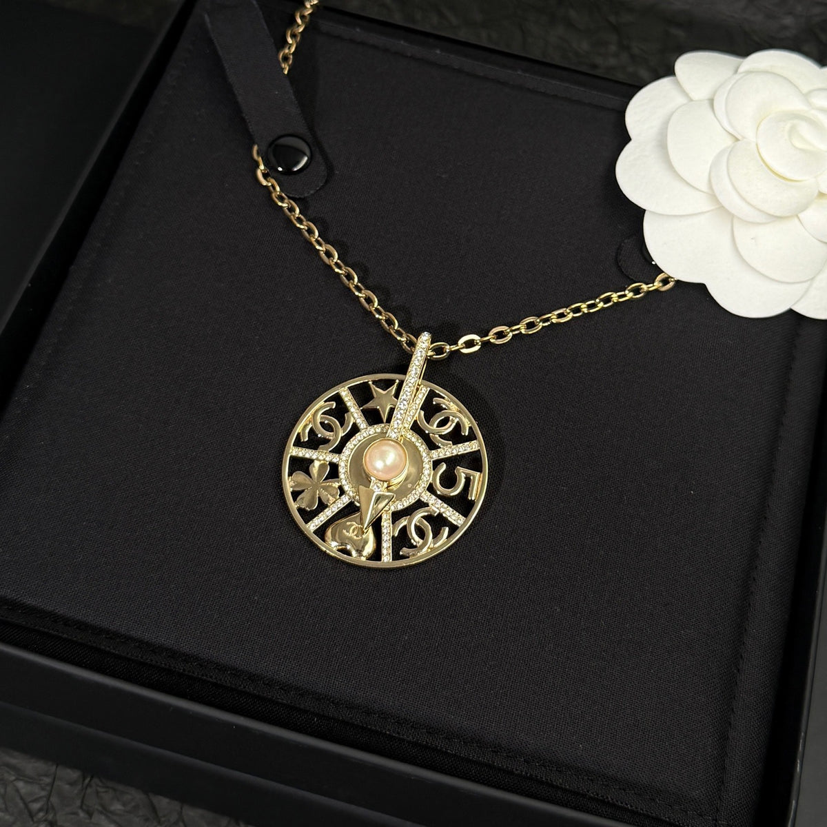 Chanel - Other - Gold-tone metal with crystal-style rhinestones and a faux pearl. - Gold