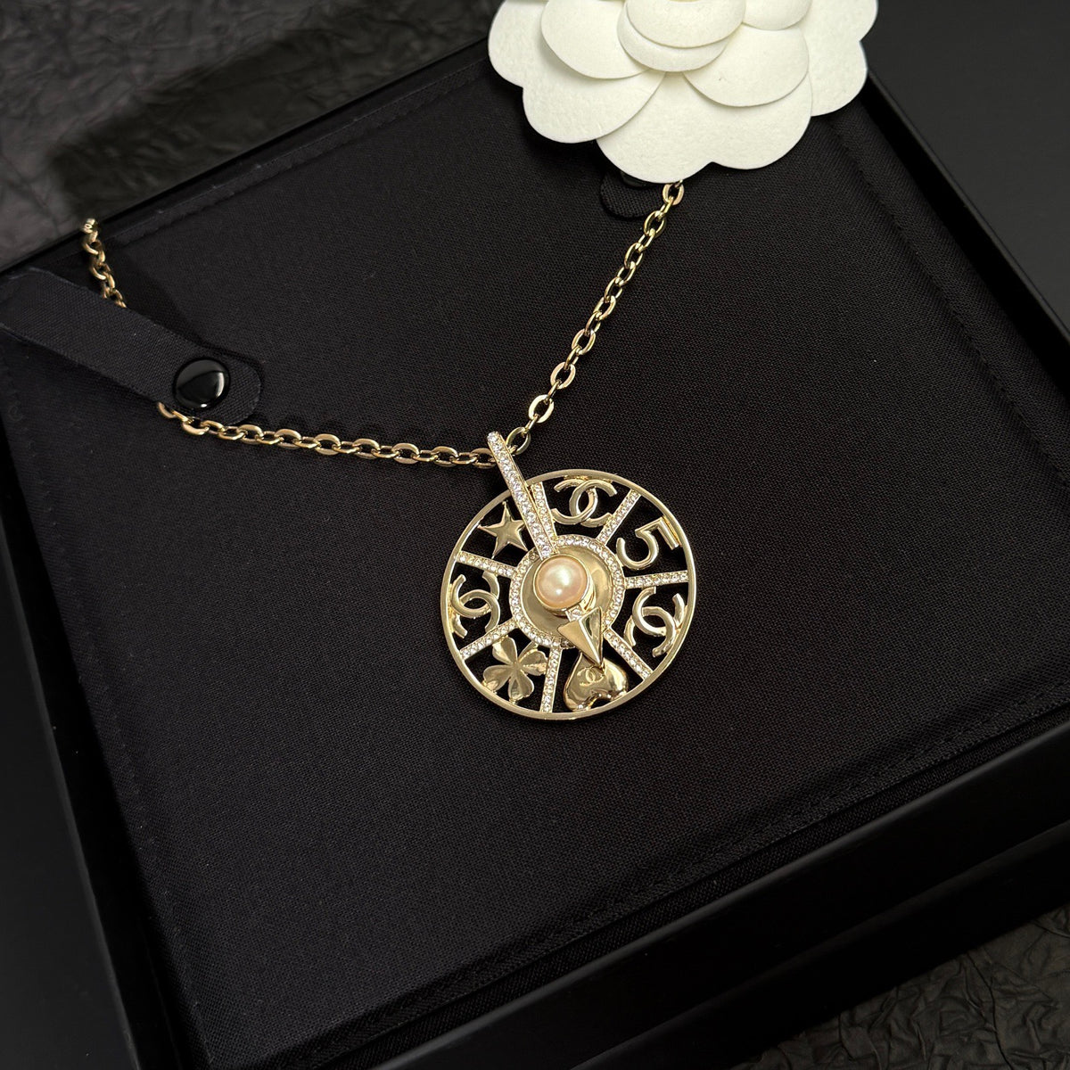 Chanel - Other - Gold-tone metal with crystal-style rhinestones and a faux pearl. - Gold
