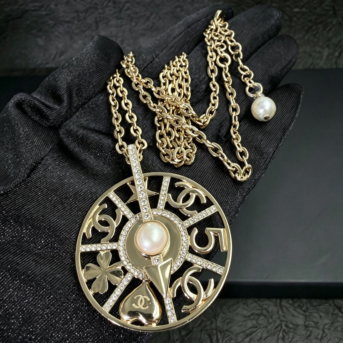 Chanel - Other - Gold-tone metal with crystal-style rhinestones and a faux pearl. - Gold