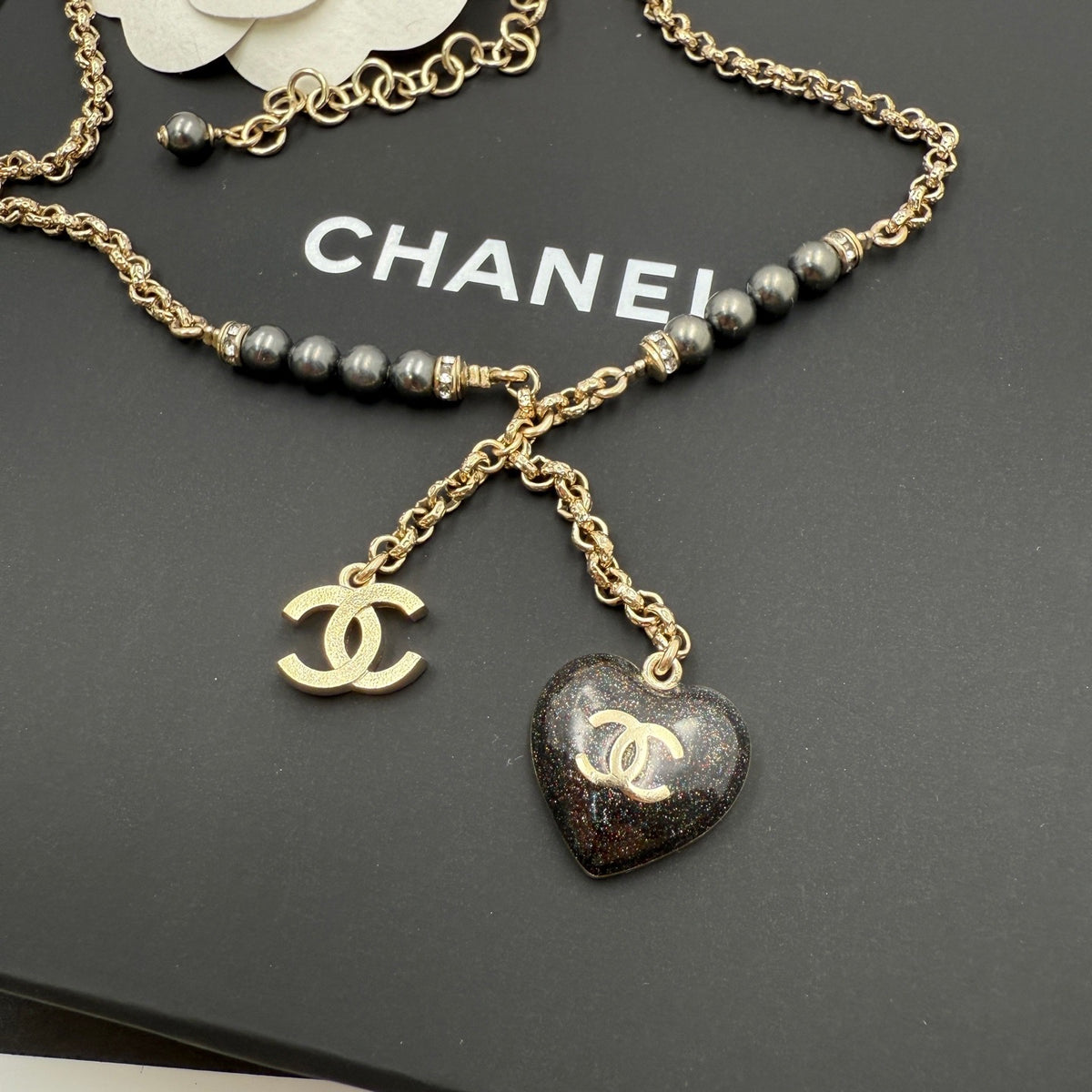 Chanel - Other - Gold-tone metal with dark grey pearl-like beads and clear crystal-like accents; the exact materials of the beads and accents are unspecified. - Gold - (39+7)