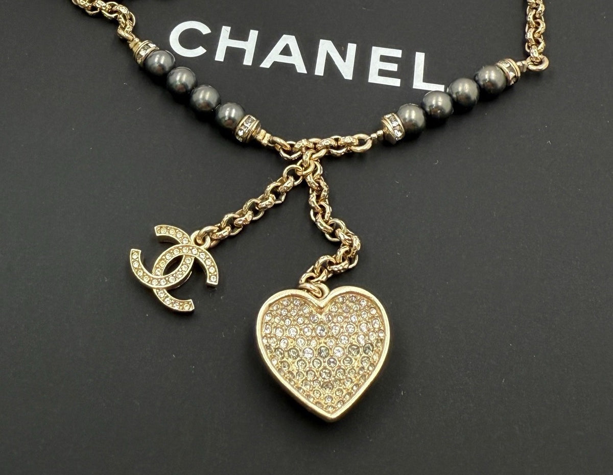 Chanel - Other - Gold-tone metal with dark grey pearl-like beads and clear crystal-like accents; the exact materials of the beads and accents are unspecified. - Gold - (39+7)