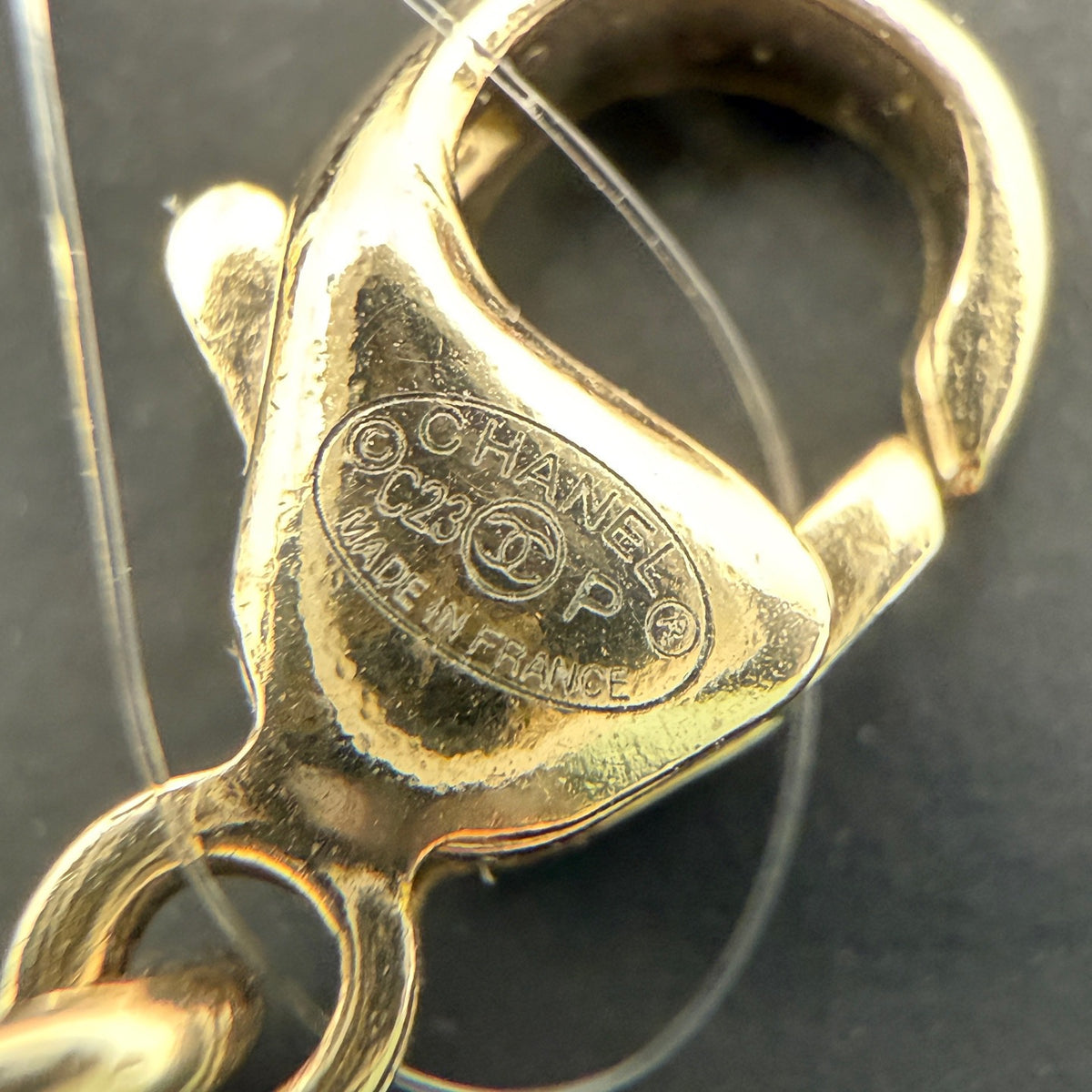 Chanel - Other - Gold-tone metal with dark grey pearl-like beads and clear crystal-like accents; the exact materials of the beads and accents are unspecified. - Gold - (39+7)