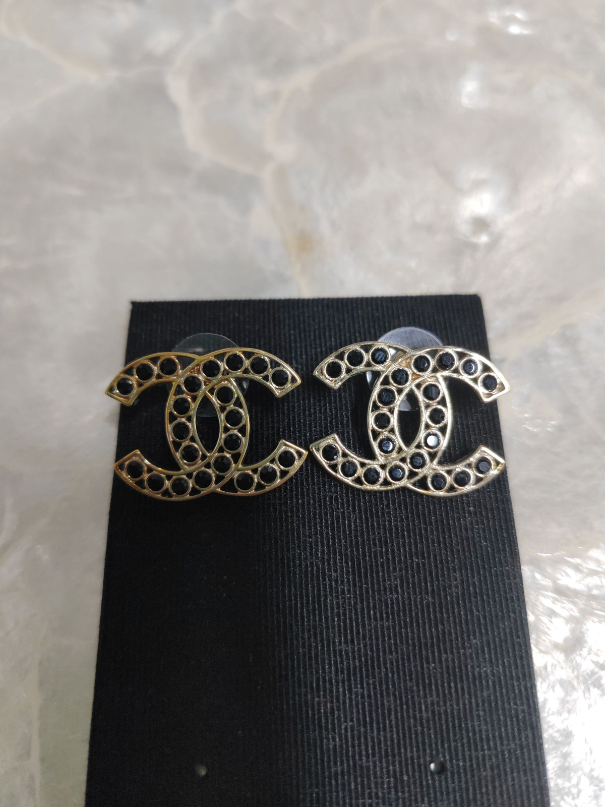 Chanel - Other - Gold-tone metal with dark stone accents; exact stone composition is unconfirmed. - Gold
