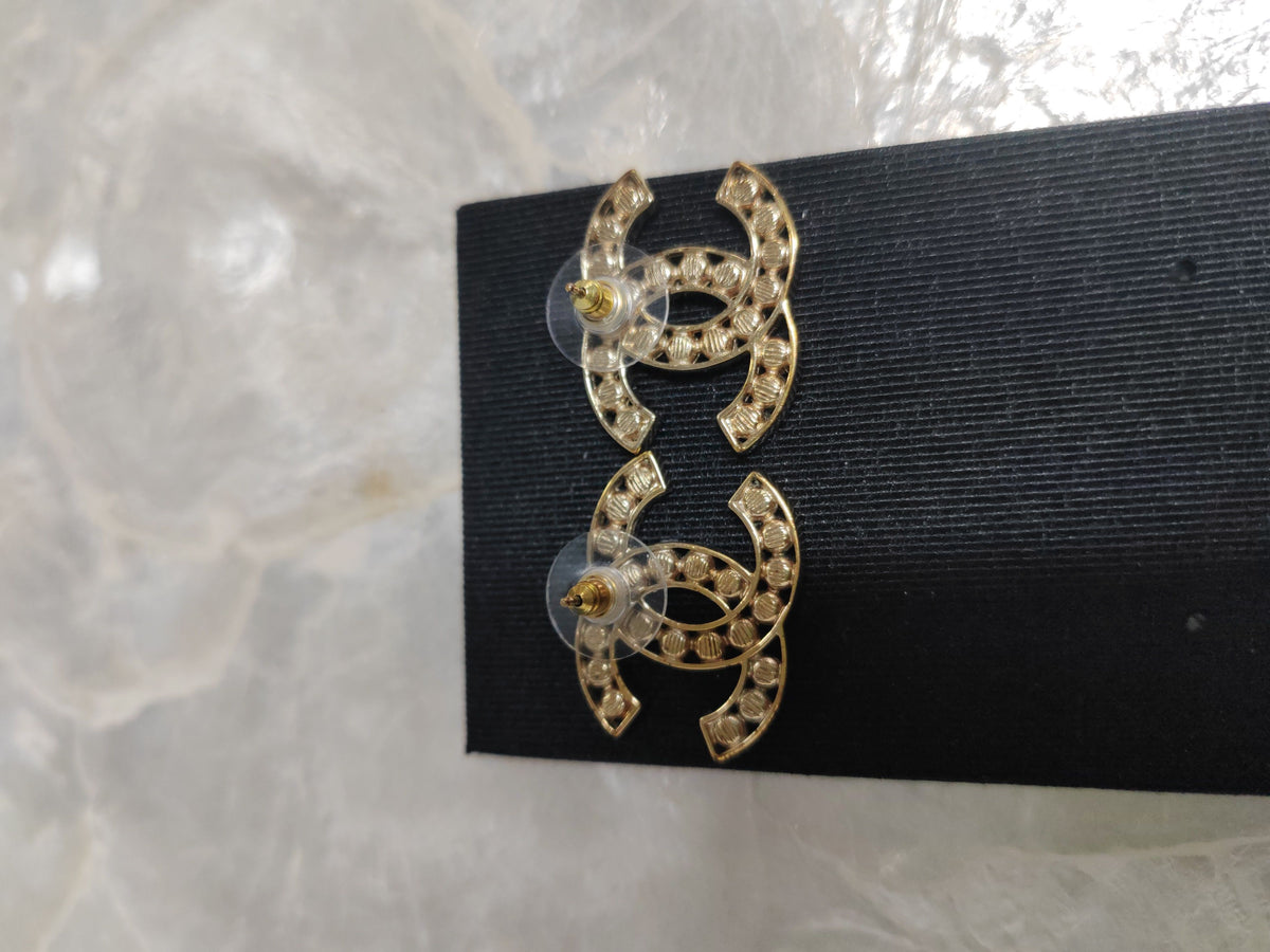 Chanel - Other - Gold-tone metal with dark stone accents; exact stone composition is unconfirmed. - Gold