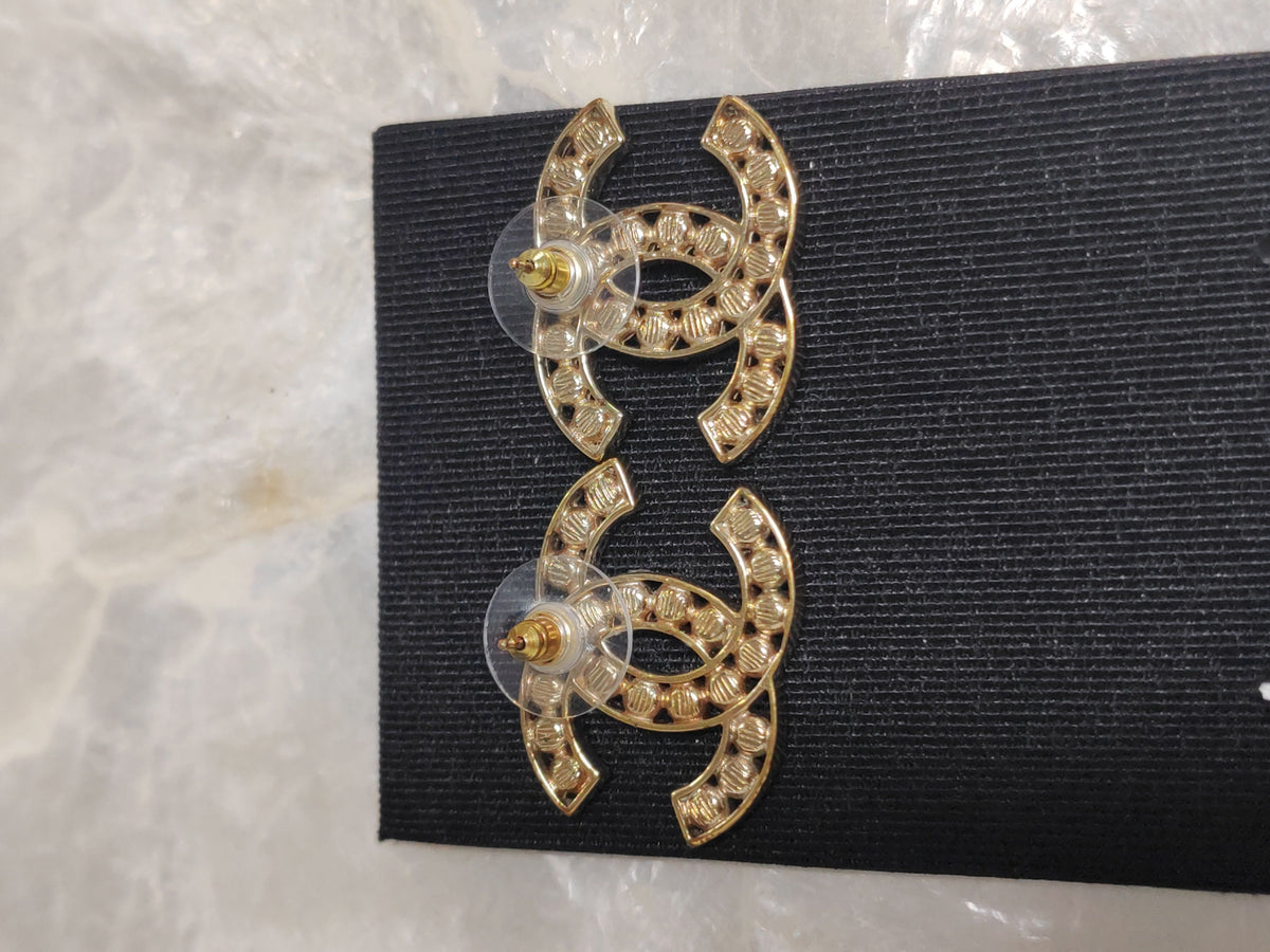 Chanel - Other - Gold-tone metal with dark stone accents; exact stone composition is unconfirmed. - Gold