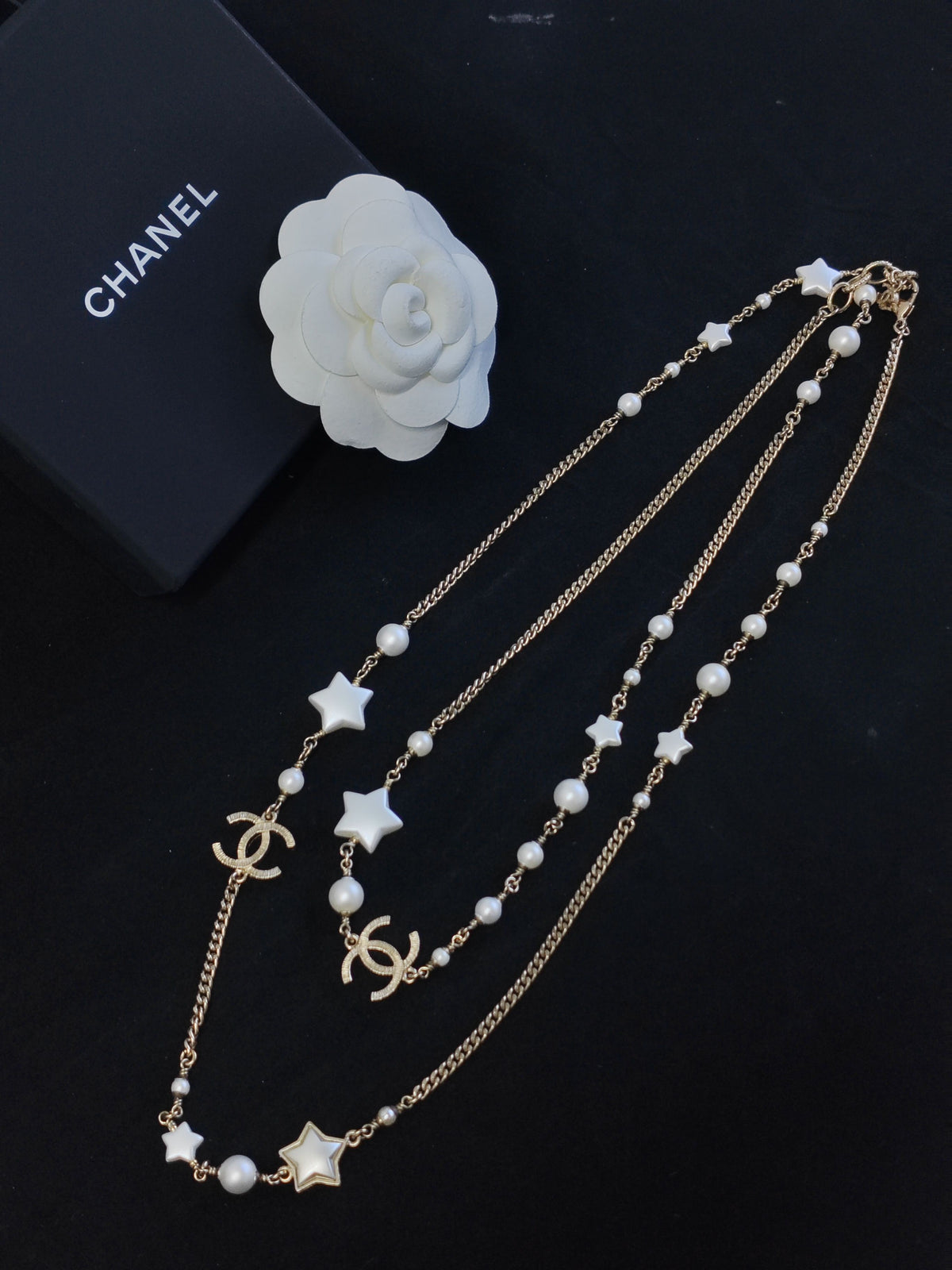 Chanel - Other - Gold-tone metal with faux pearl and star-shaped resin accents. - Multicolour