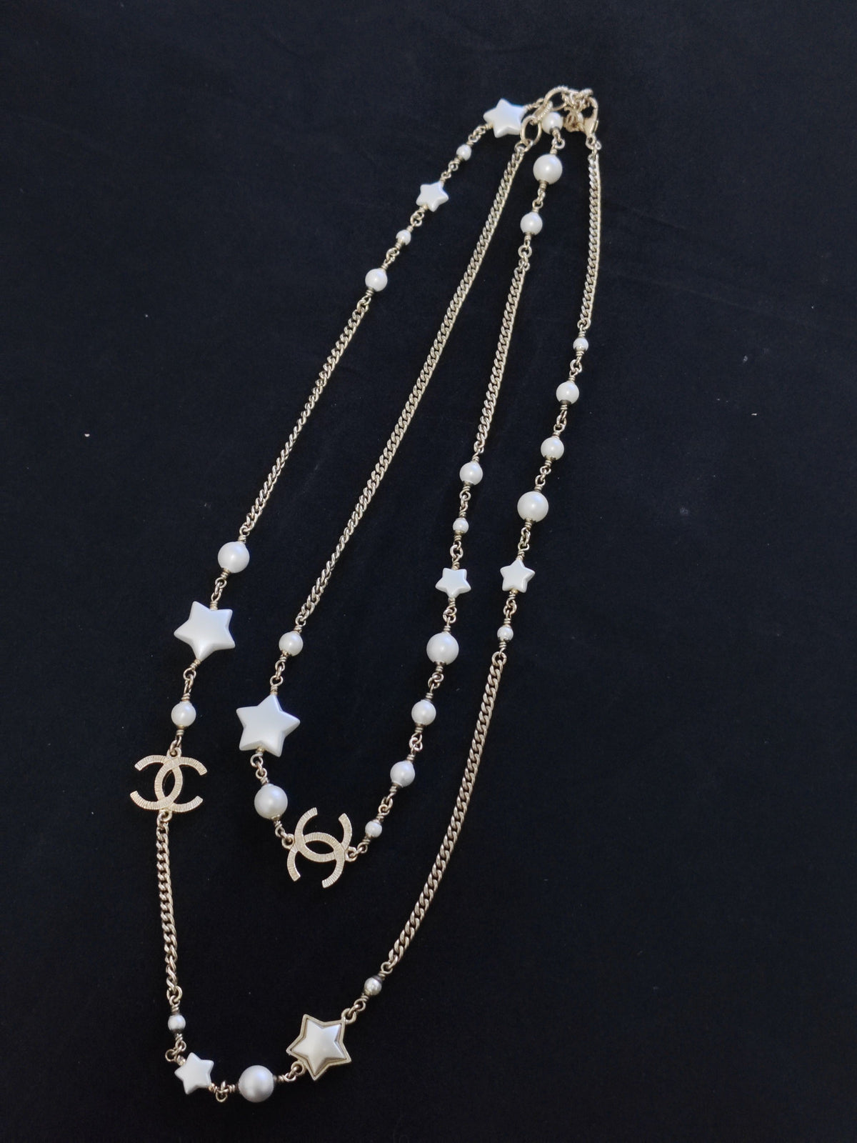 Chanel - Other - Gold-tone metal with faux pearl and star-shaped resin accents. - Multicolour