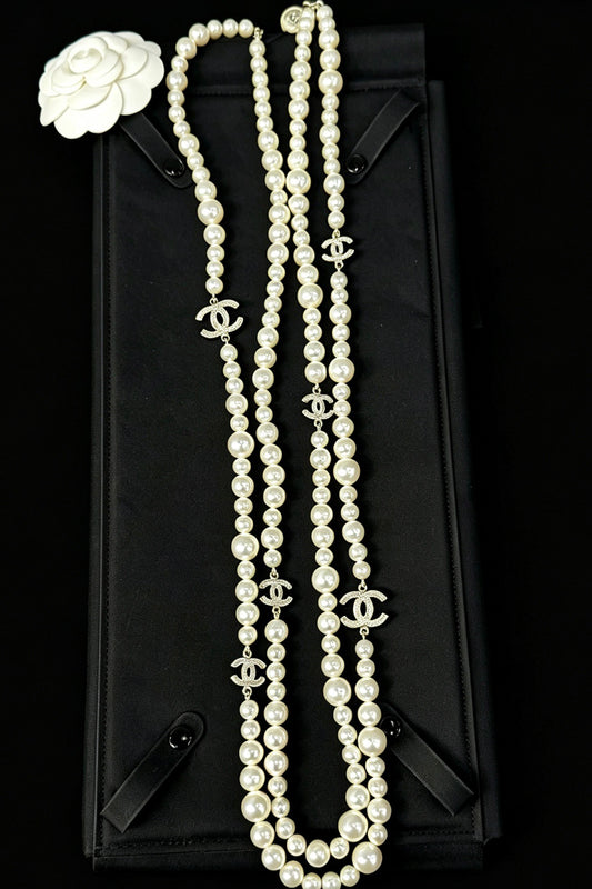Chanel - Other - Gold-tone metal with faux pearl beads and crystal accents. - White